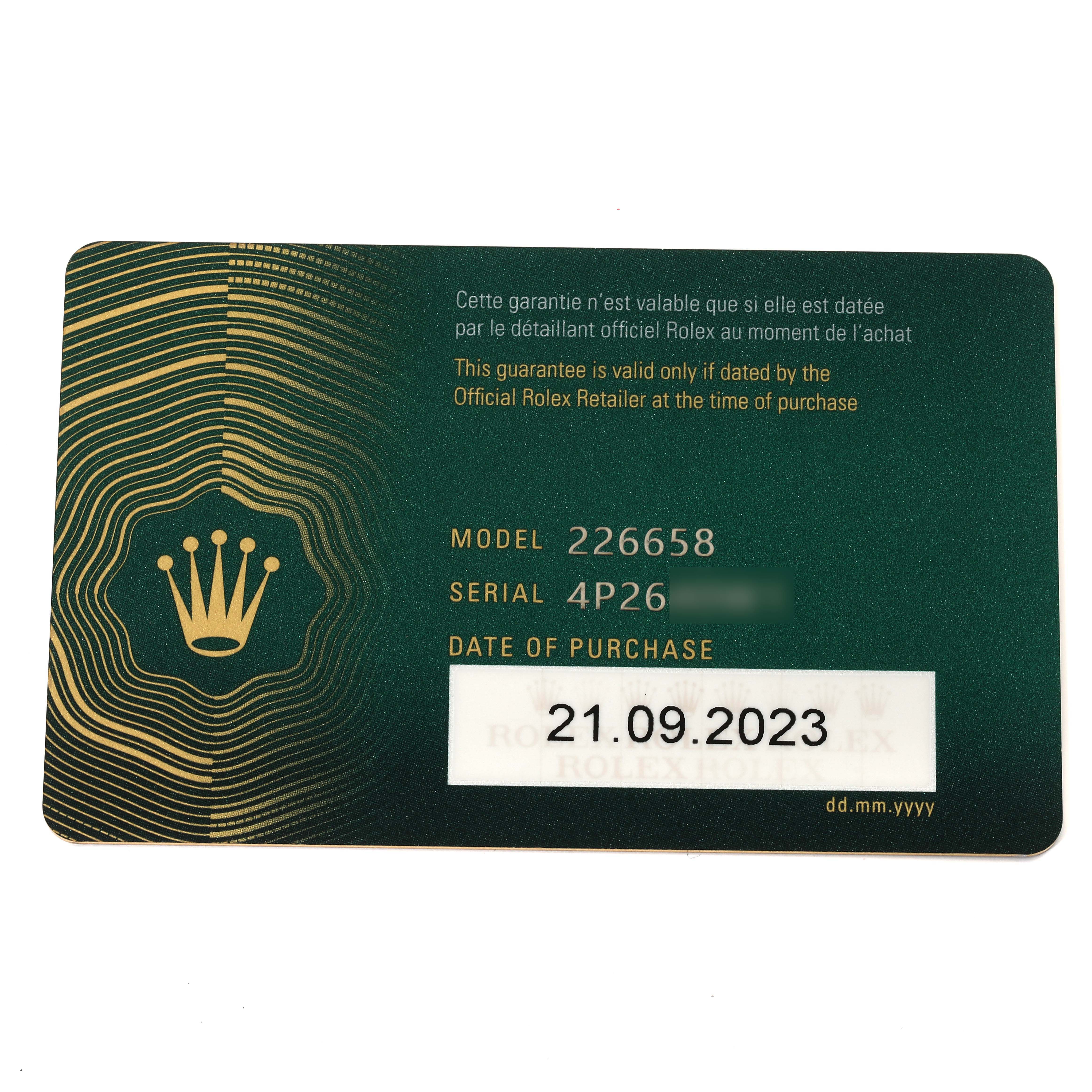 The image shows a flat-lay view of a Rolex Yacht-Master 226658 Men's Yellow Gold Black Dial 226658 Men's Yellow Gold Black Dial model warranty card with model, serial number, and date of purchase details.