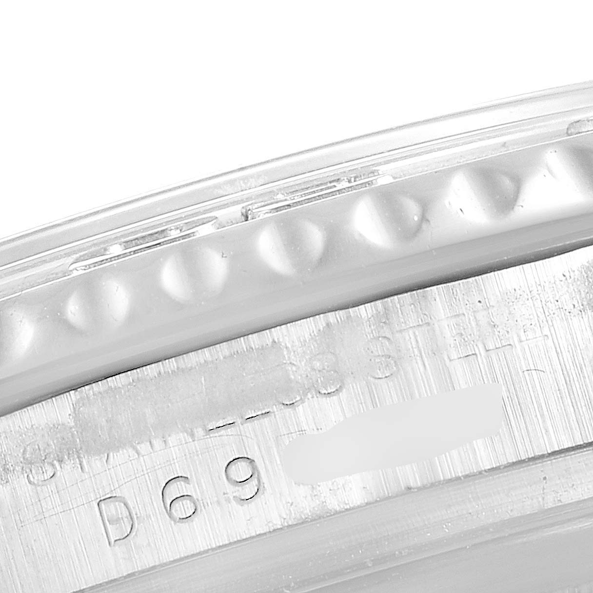 This close-up image shows the serial number engraving on the case edge of a Rolex Yacht-Master 16622 Men's Stainless Steel Silver Dial 16622 Men's Stainless Steel Silver Dial watch.