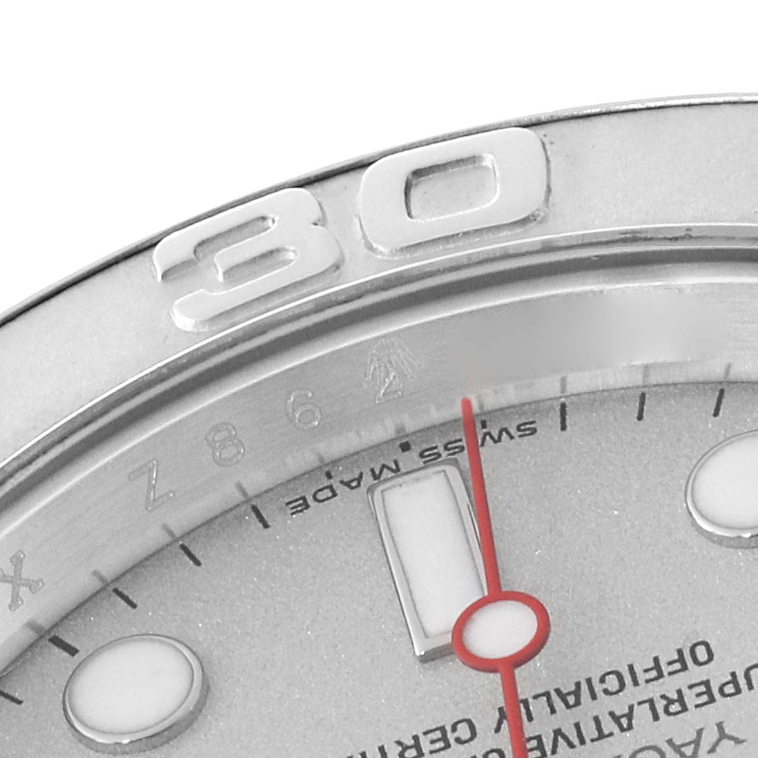 The image shows a close-up of the Rolex Yacht-Master 16622 Men's Platinum Silver Dial 16622 Men's Platinum Silver Dial watch's bezel, part of the dial, and the second hand.