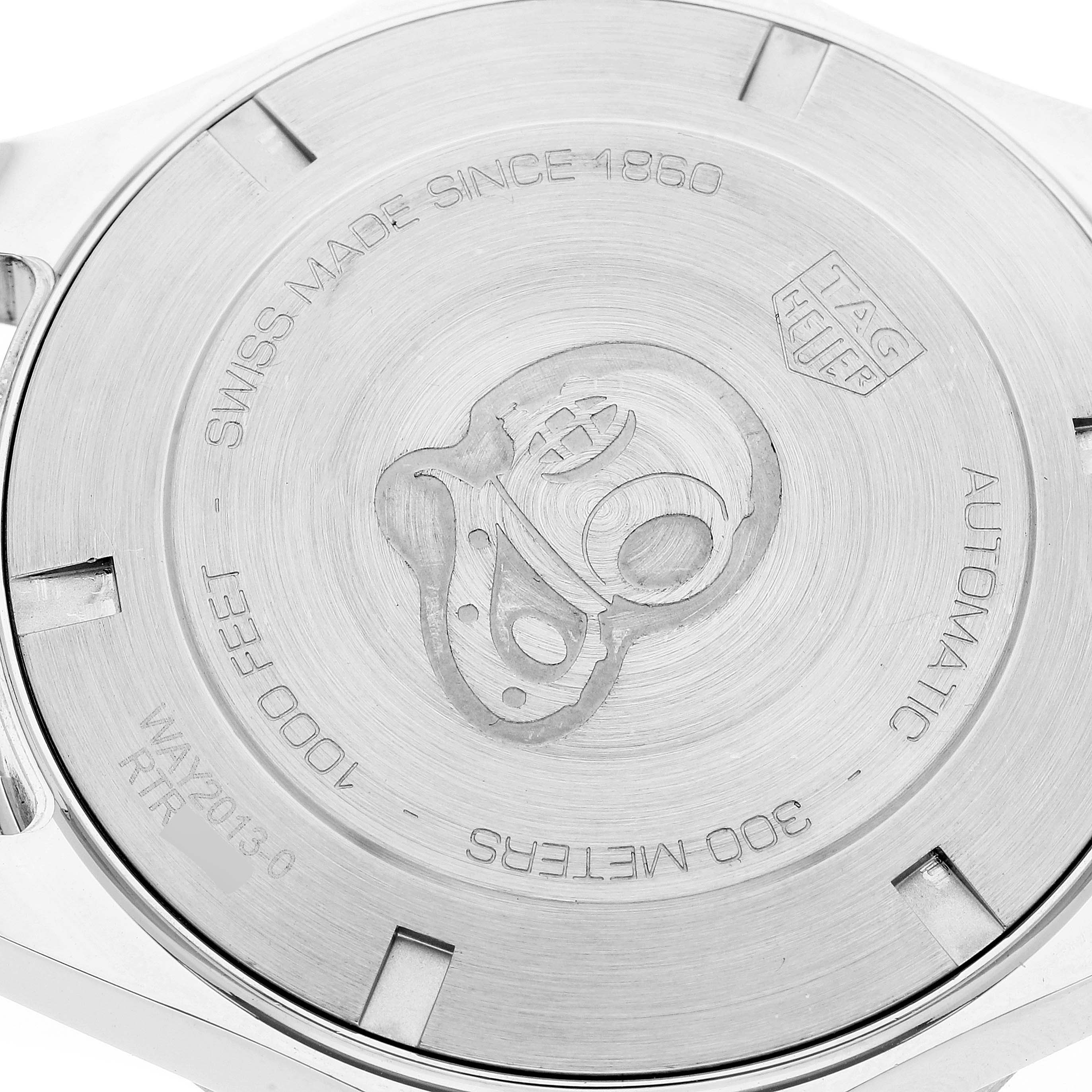 This image shows the back case of a Tag Heuer Aquaracer WAY2013.BA0927 Men's Stainless Steel White Dial WAY2013.BA0927 Men's Stainless Steel White Dial watch, highlighting its engraved details and branding.
