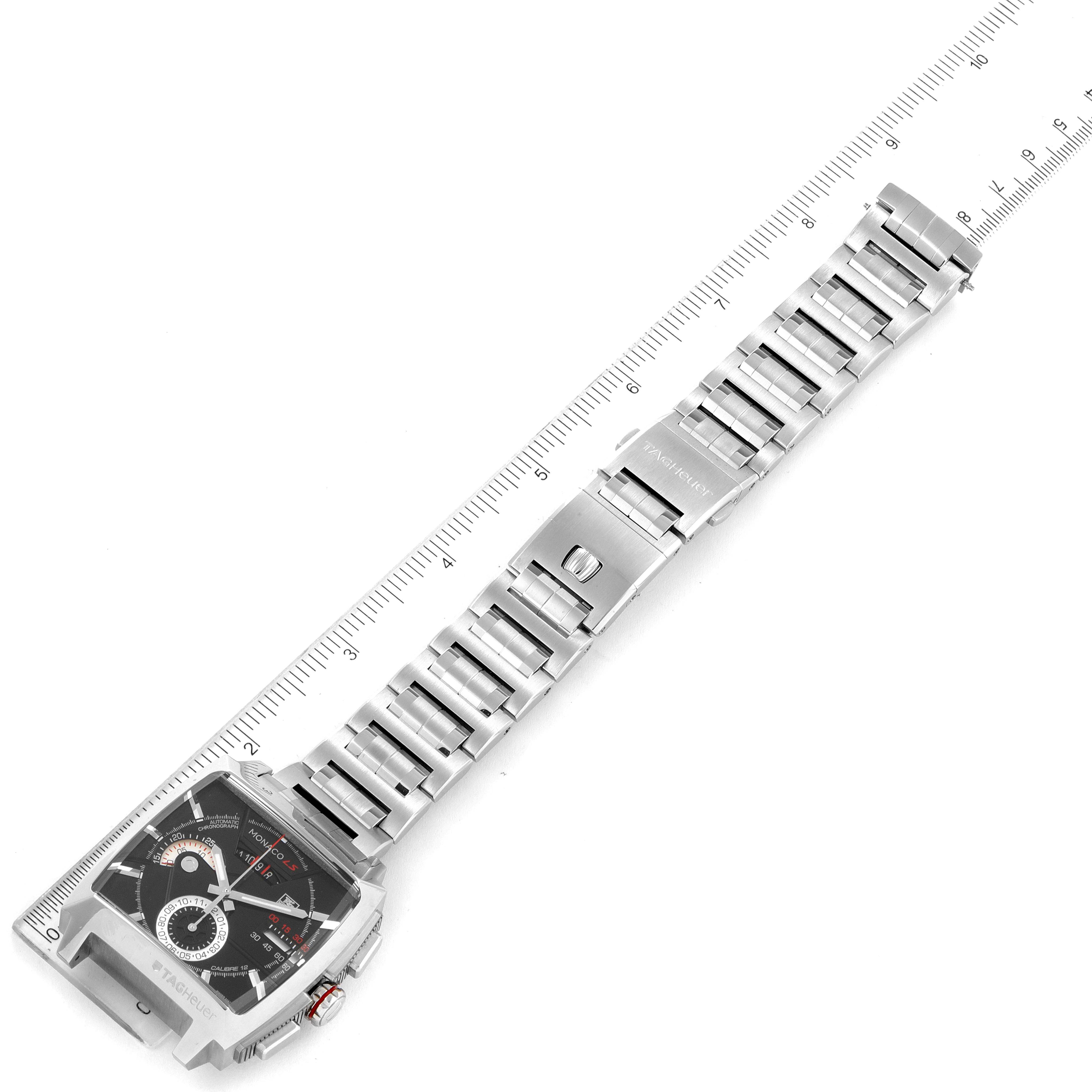 The image shows an overhead view of a Tag Heuer Monaco CAL2110.BA0781 Men's Stainless Steel Black Dial CAL2110.BA0781 Men's Stainless Steel Black Dial watch, displaying the face, bracelet, and clasp.