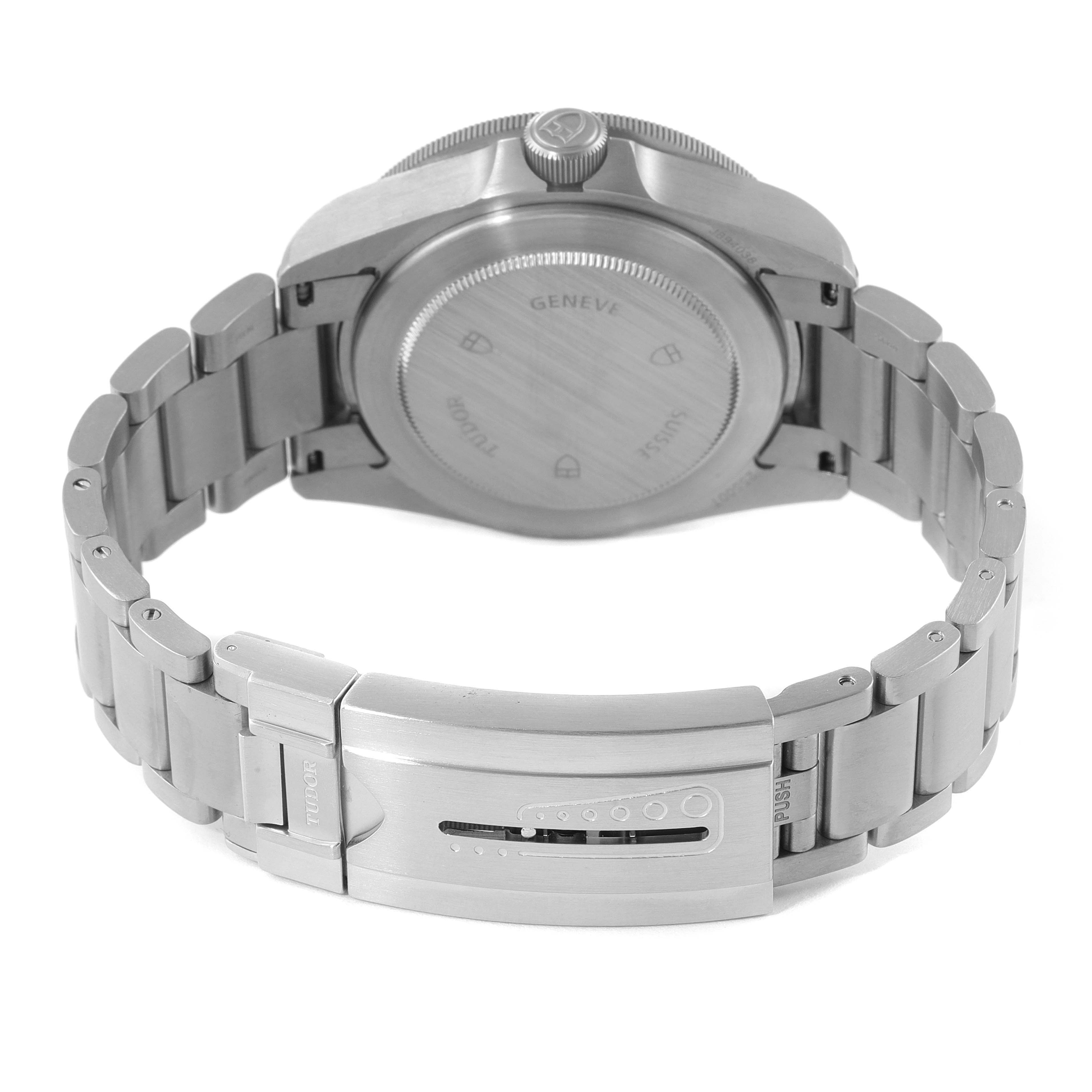 The image shows the back view of the Tudor Pelagos 25500TN Men's Titanium Black Dial 25500TN Men's Titanium Black Dial watch, highlighting the case back, crown, and bracelet with clasp.