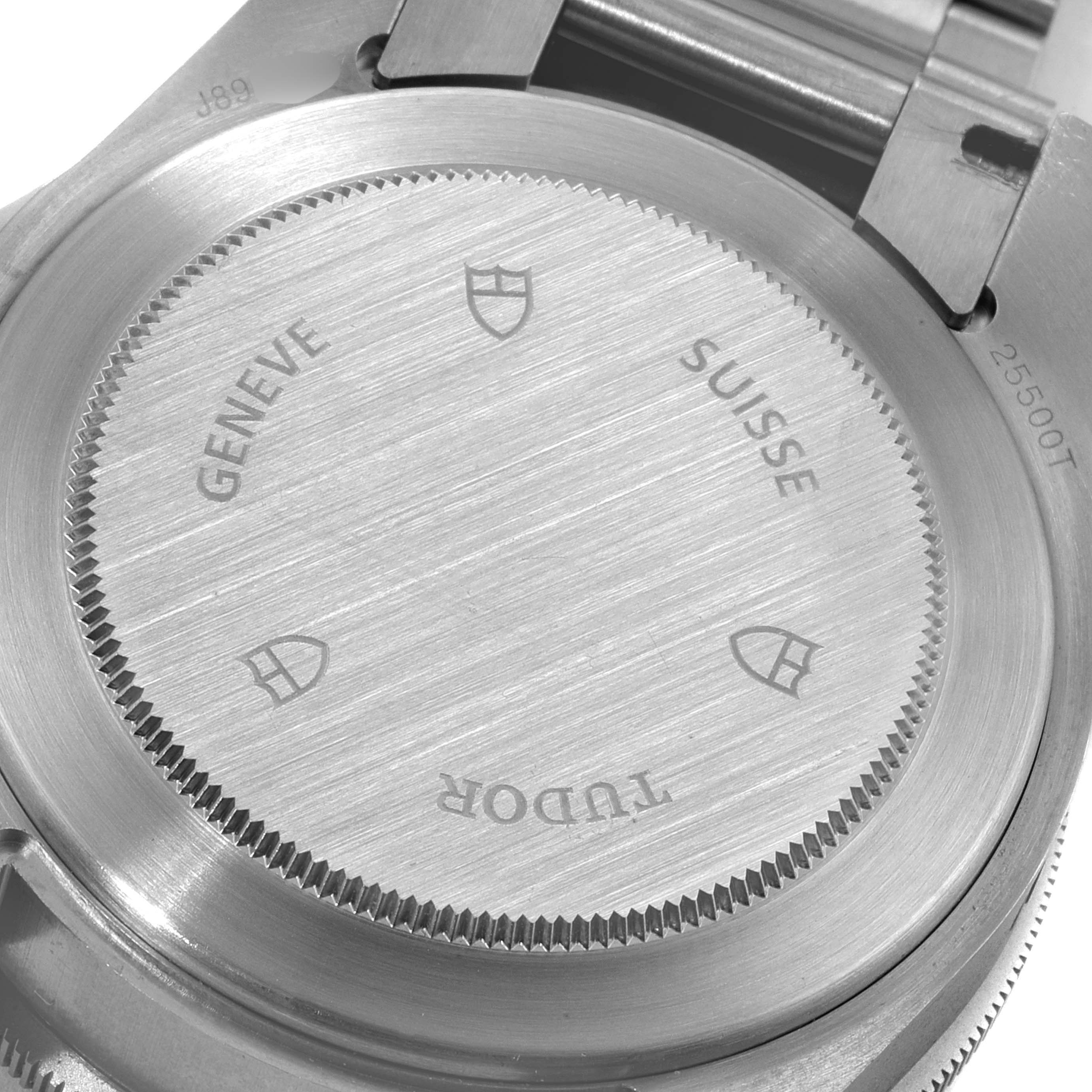 This is a close-up of the back case of a Tudor Pelagos 25500TN Men's Titanium Black Dial 25500TN Men's Titanium Black Dial watch, showing its brushed metal finish and engravings.