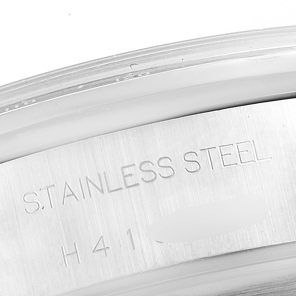 The image shows a close-up of the stainless steel back casing of a Tudor Tiger 79260 Men's Stainless Steel Black Dial 79260 Men's Stainless Steel Black Dial model watch.