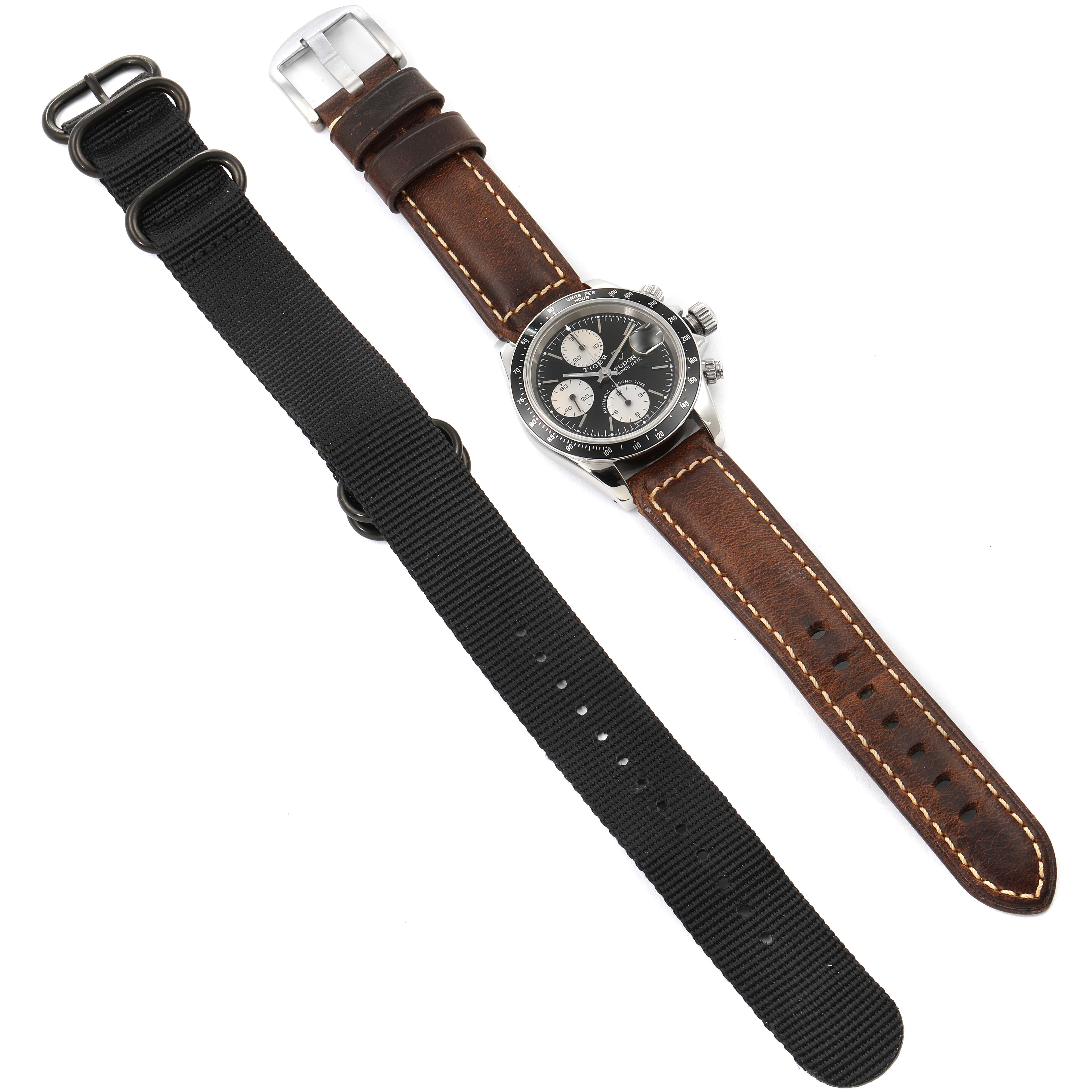 The image shows a Tudor Tiger 79260 Men's Stainless Steel Black Dial 79260 Men's Stainless Steel Black Dial watch with a brown leather strap and an additional black NATO strap.