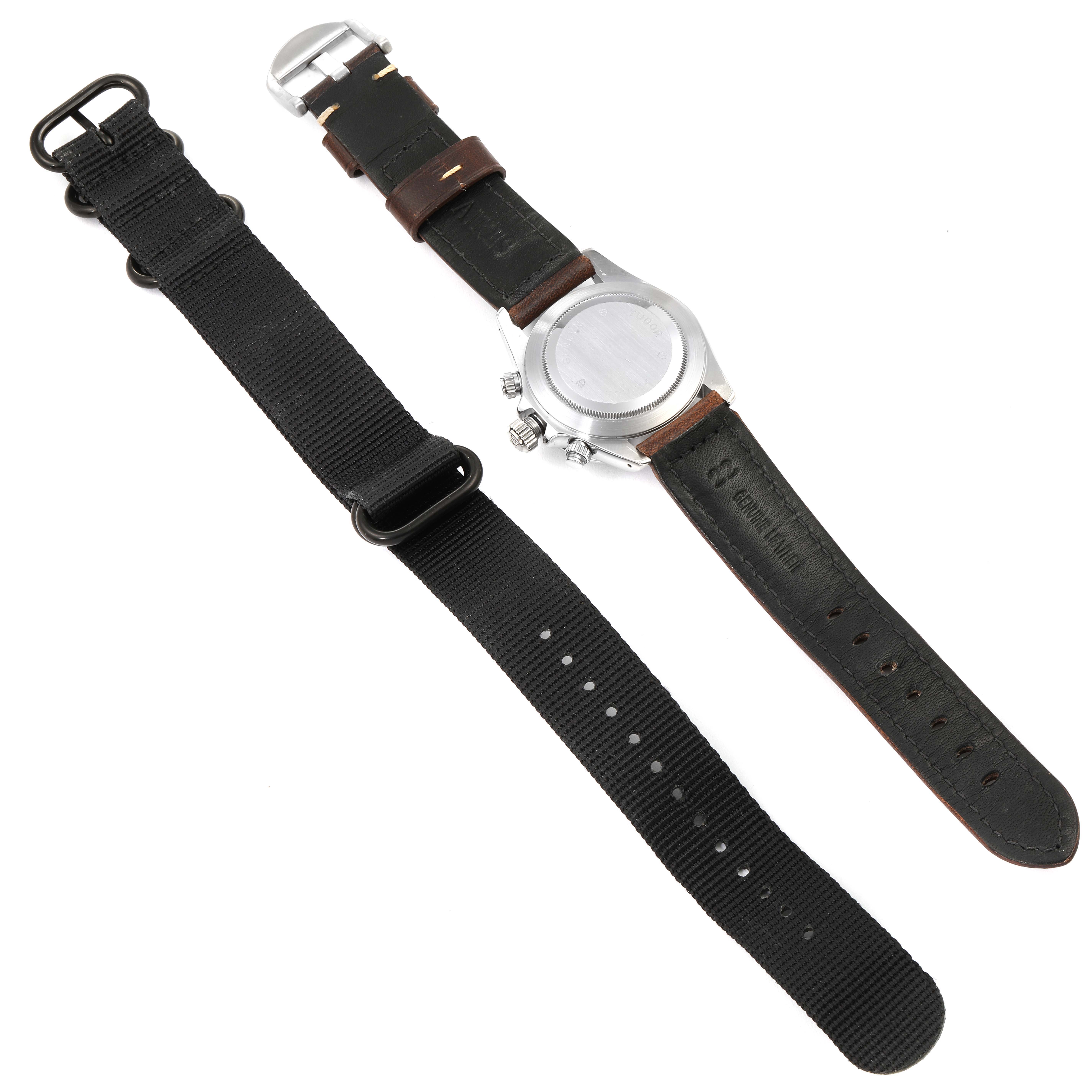 The image shows the back of the Tudor Tiger 79260 Men's Stainless Steel Black Dial 79260 Men's Stainless Steel Black Dial model watch and its black and brown leather straps.