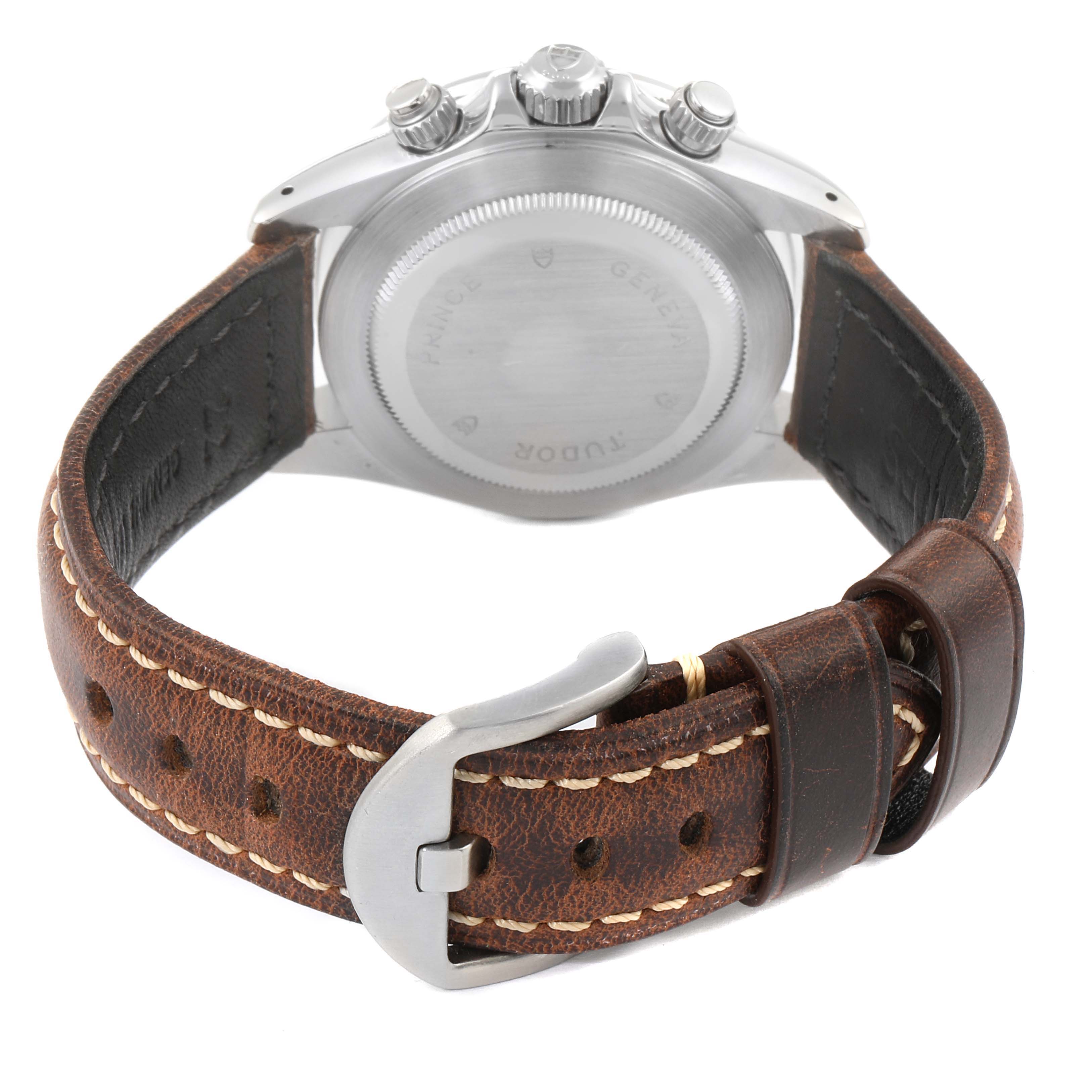 The image shows the back view of a Tudor Tiger 79260 Men's Stainless Steel Black Dial 79260 Men's Stainless Steel Black Dial model watch, focusing on the case back, pushers, and brown leather strap with a buckle.