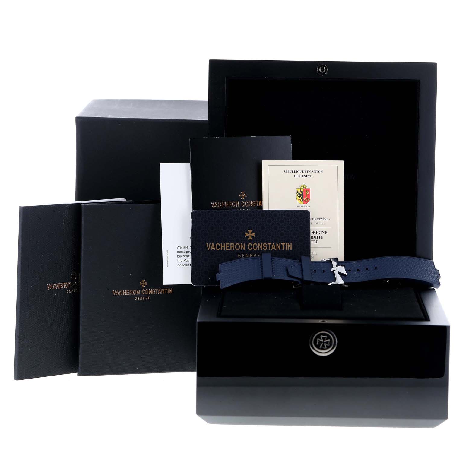 The image shows the packaging, documents, and a blue strap for the Vacheron Constantin Overseas 7900V/110A-B334 Men
s Stainless Steel Blue Dial 7900V/110A-B334 Men
s Stainless Steel Blue Dial model watch.