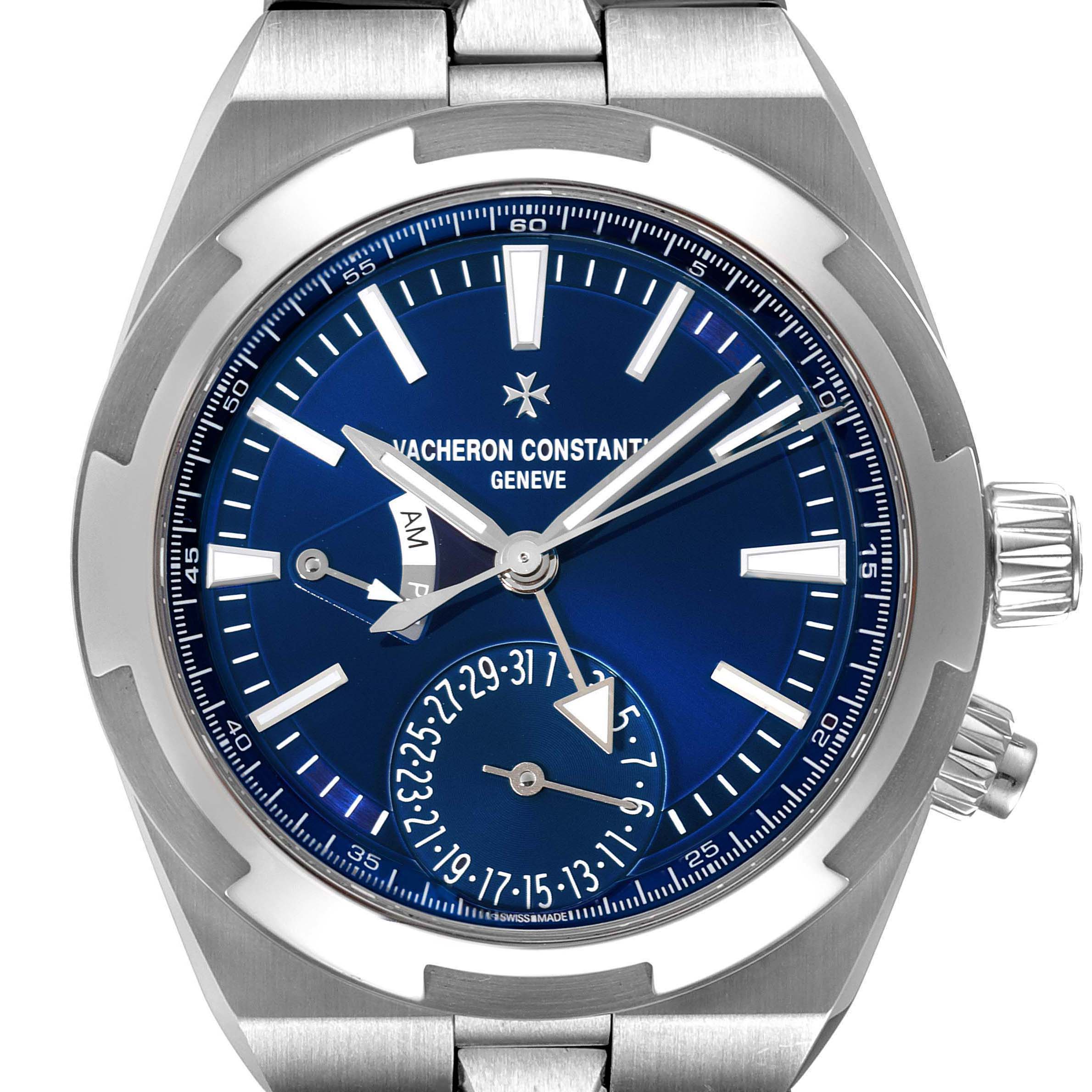 The Vacheron Constantin Overseas 7900V/110A-B334 Men
s Stainless Steel Blue Dial 7900V/110A-B334 Men
s Stainless Steel Blue Dial watch is shown from a front angle, displaying the dial, bezel, hands, and part of the bracelet.