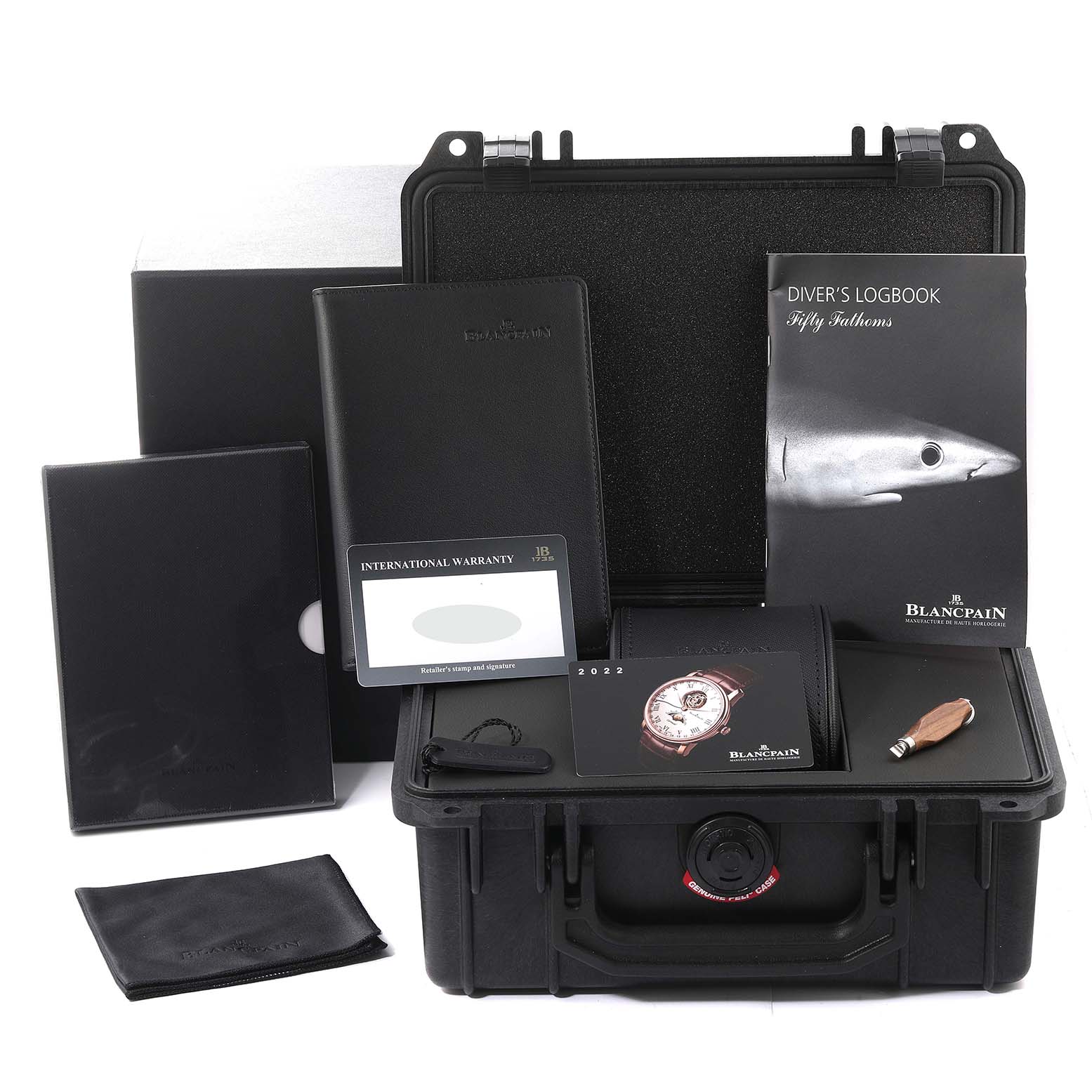 The image shows the Blancpain Fifty Fathoms 5015-1130-52A Men's Stainless Steel Black Dial 5015-1130-52A Men's Stainless Steel Black Dial packaging and accessories, including a diver's logbook, international warranty card, and carrying case.