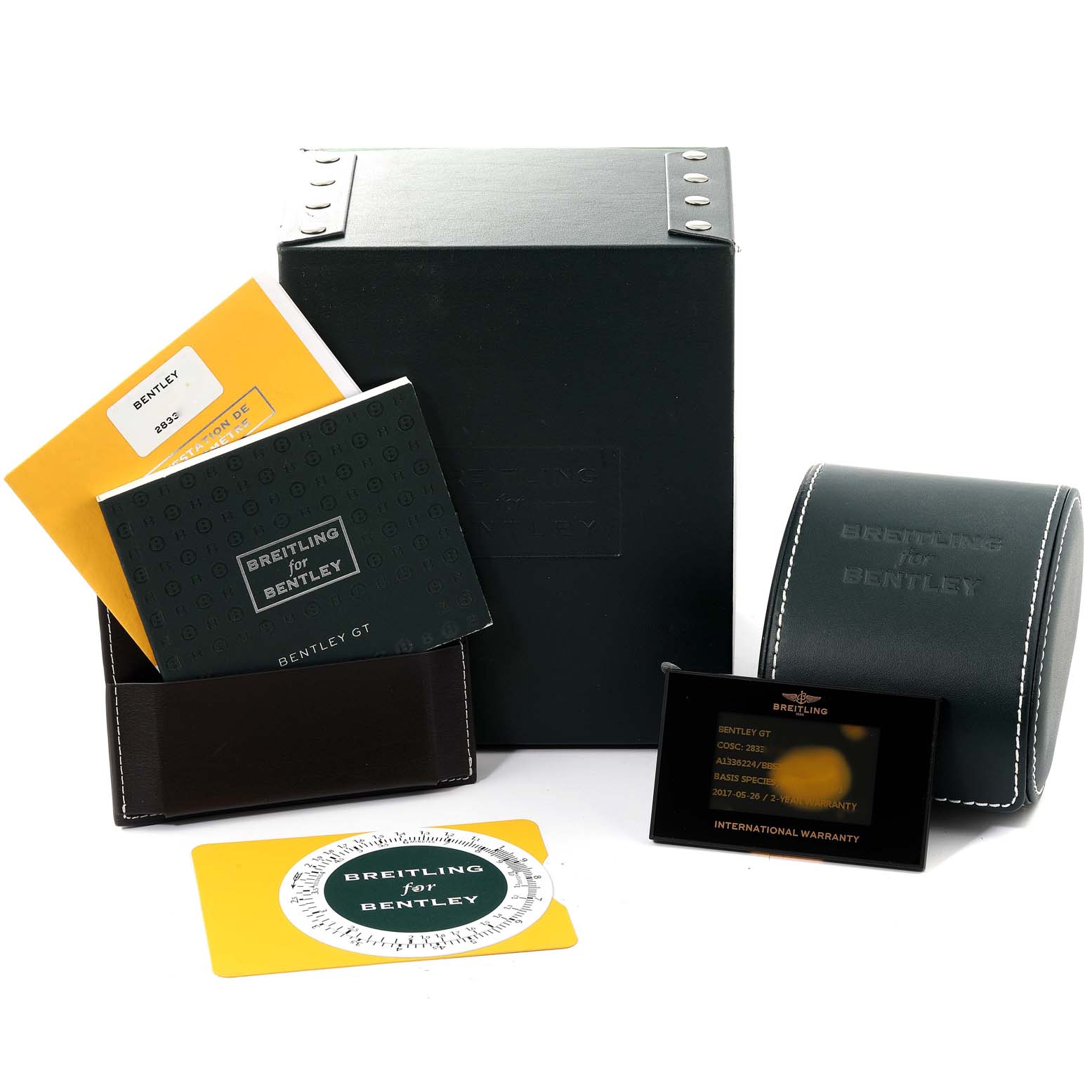The image shows Breitling for Bentley watch accessories, including manuals, a box, a carrying case, and an international warranty card.