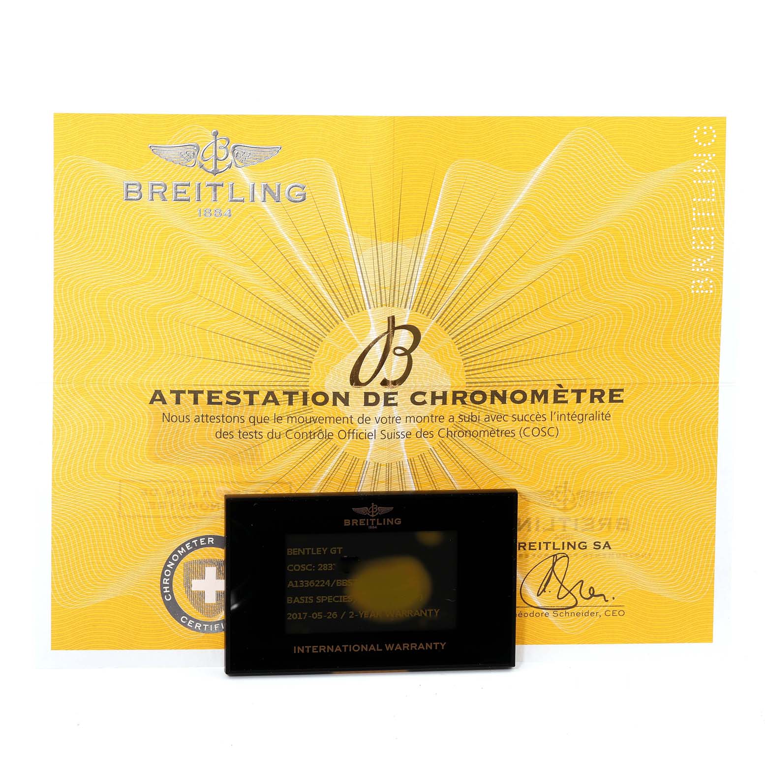 The image shows the certification document and the warranty card for a Bentley model watch by Breitling.