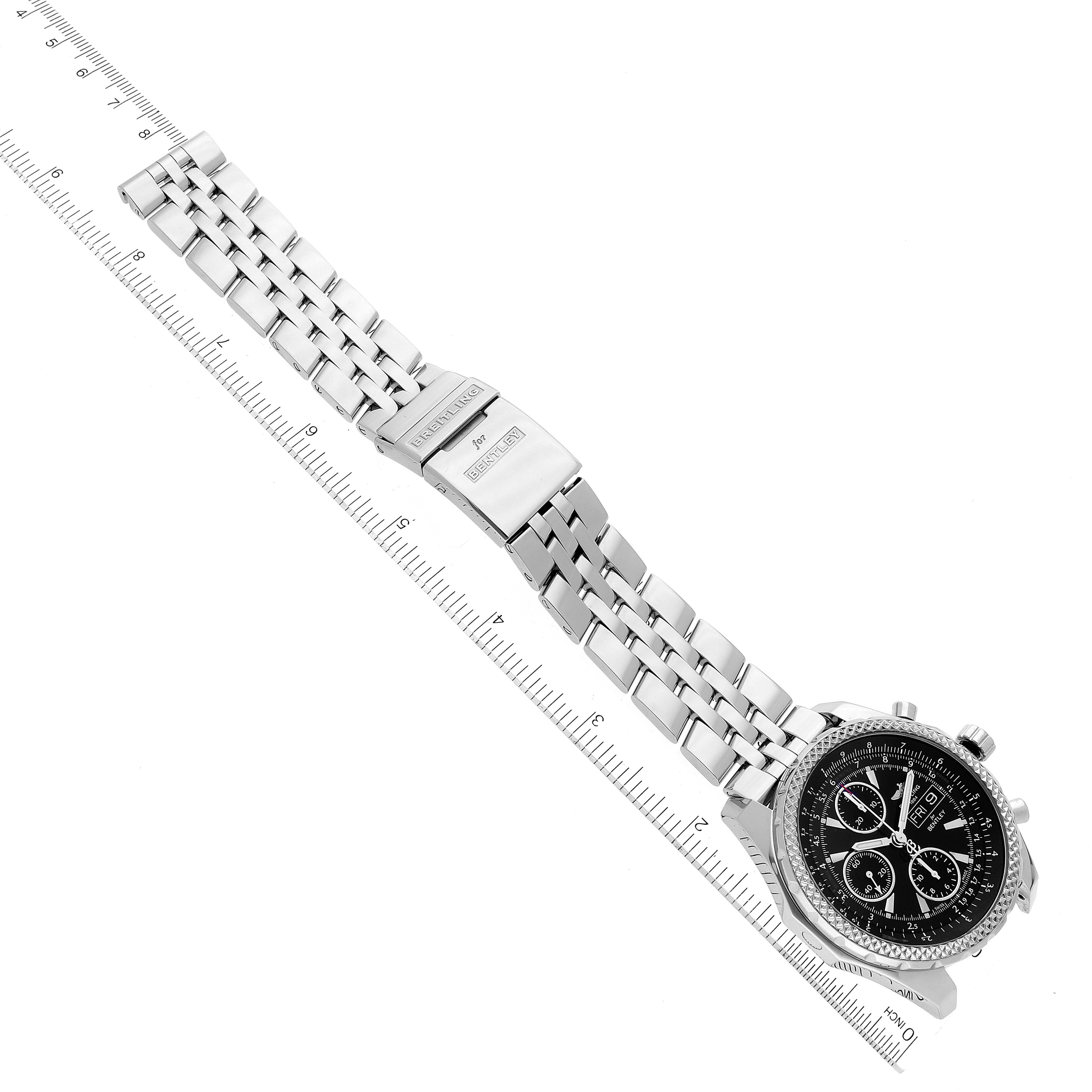 The image shows a Bentley model by Breitling at an angled top-down view, highlighting its silver bracelet and detailed black watch face.