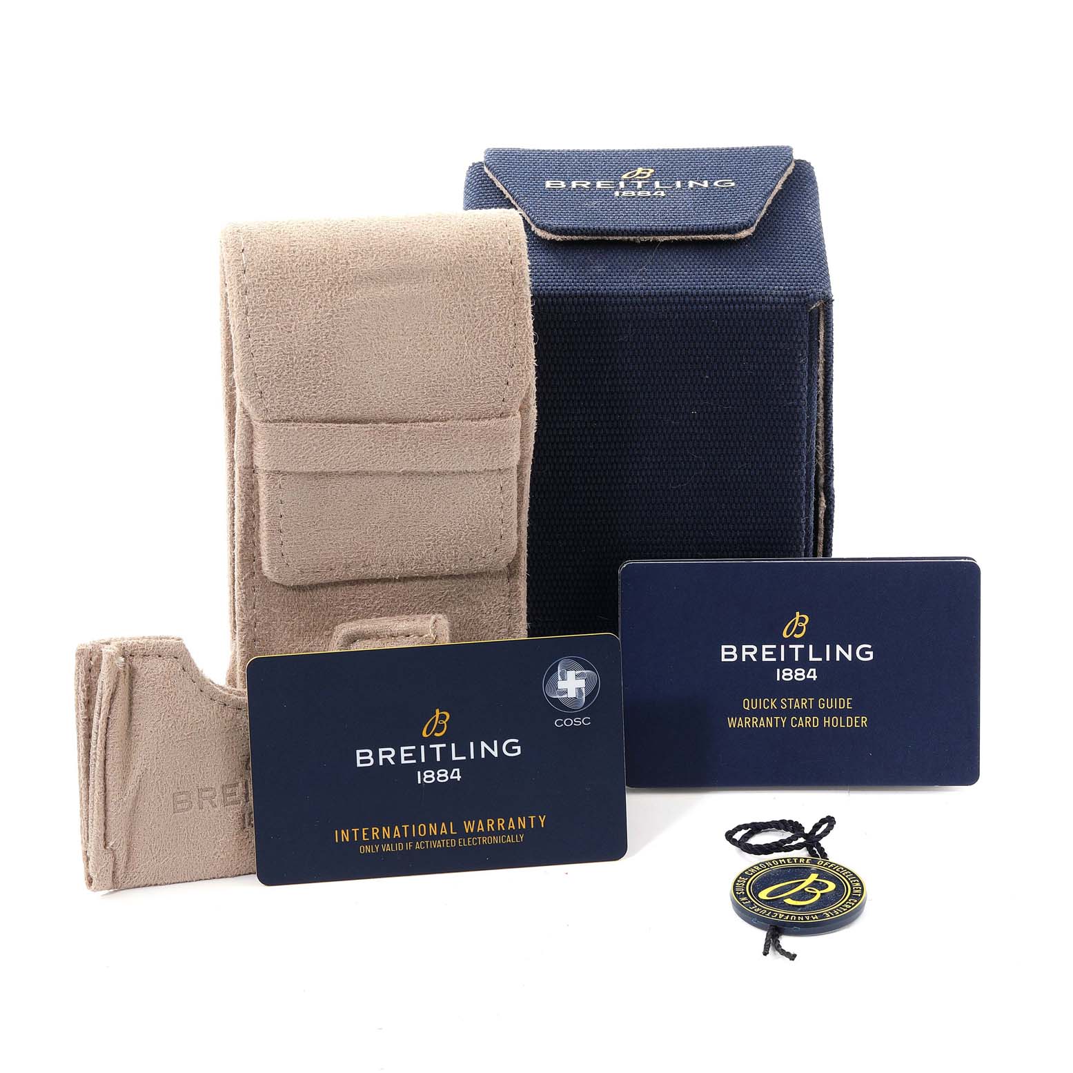 The image shows a Premier model by Breitling's packaging, including a box, travel case, warranty card, and quick start guide.