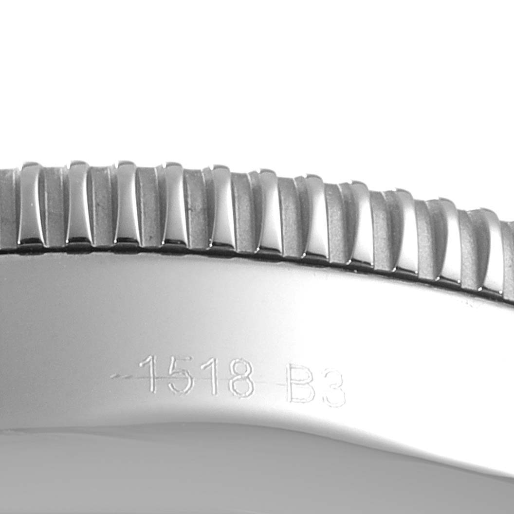This image shows a close-up of the bezel and engraved serial number on the Breitling Superocean AB2020 Men's Stainless Steel Blue Dial AB2020 Men's Stainless Steel Blue Dial watch.