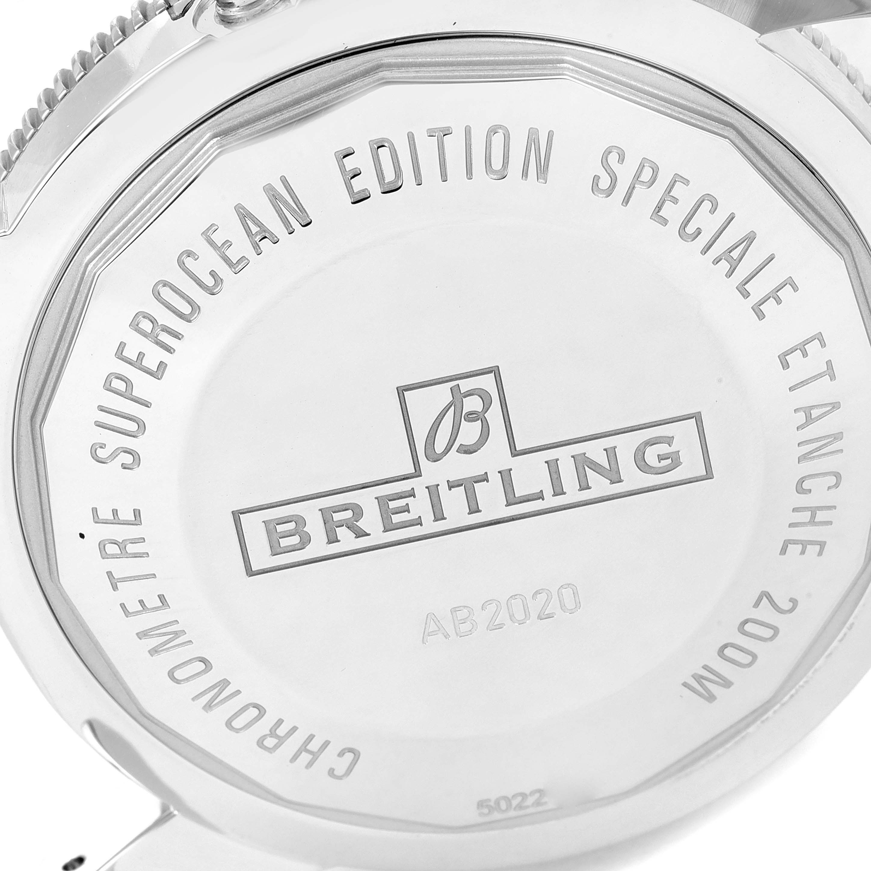 The image shows the back case of a Breitling Superocean AB2020 Men's Stainless Steel Blue Dial AB2020 Men's Stainless Steel Blue Dial watch, highlighting engravings and detailing.