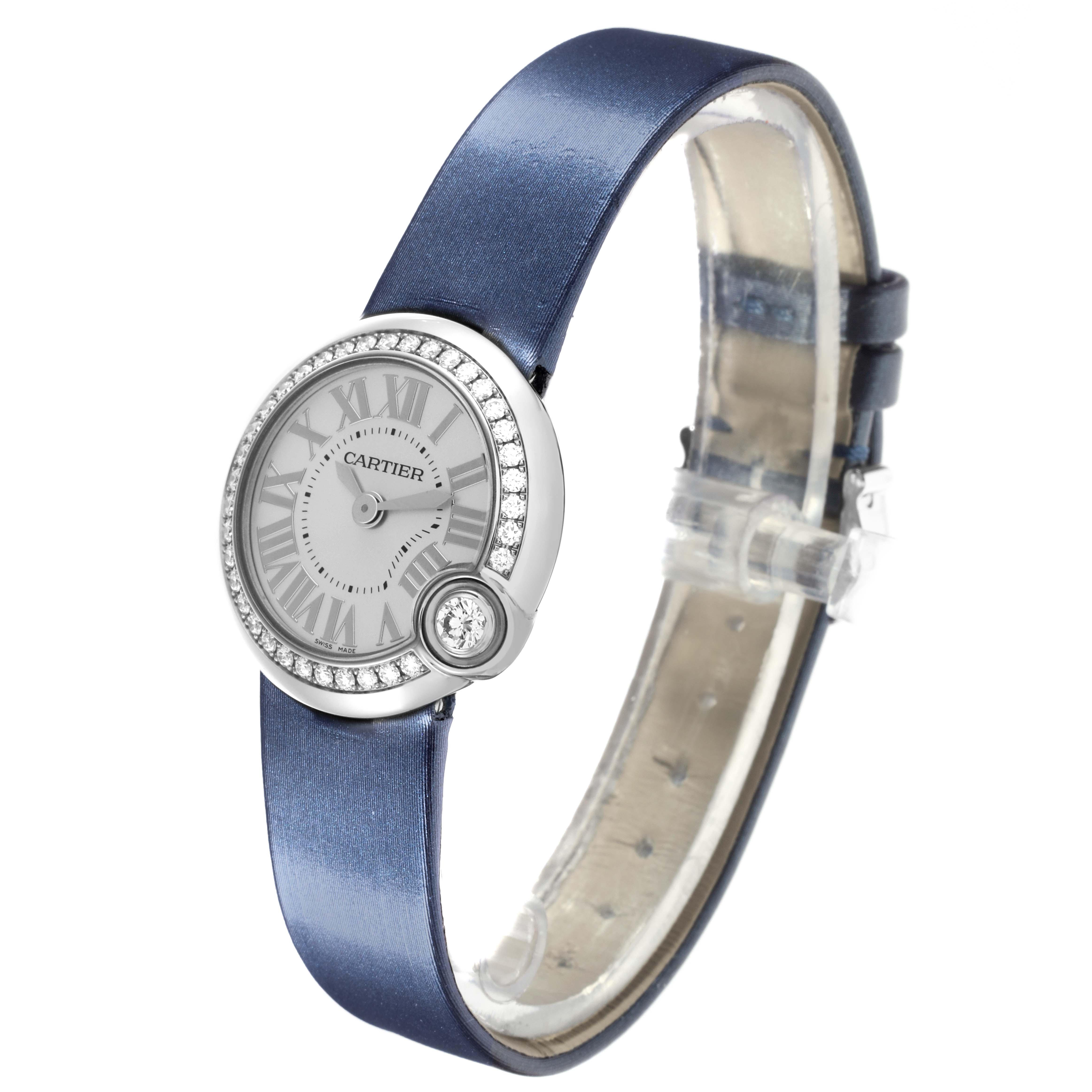 The Cartier Ballon Blanc W4BL0002 Women's Stainless Steel Silver Dial W4BL0002 Women's Stainless Steel Silver Dial watch is shown at an angle displaying the dial, bezel, and blue strap.