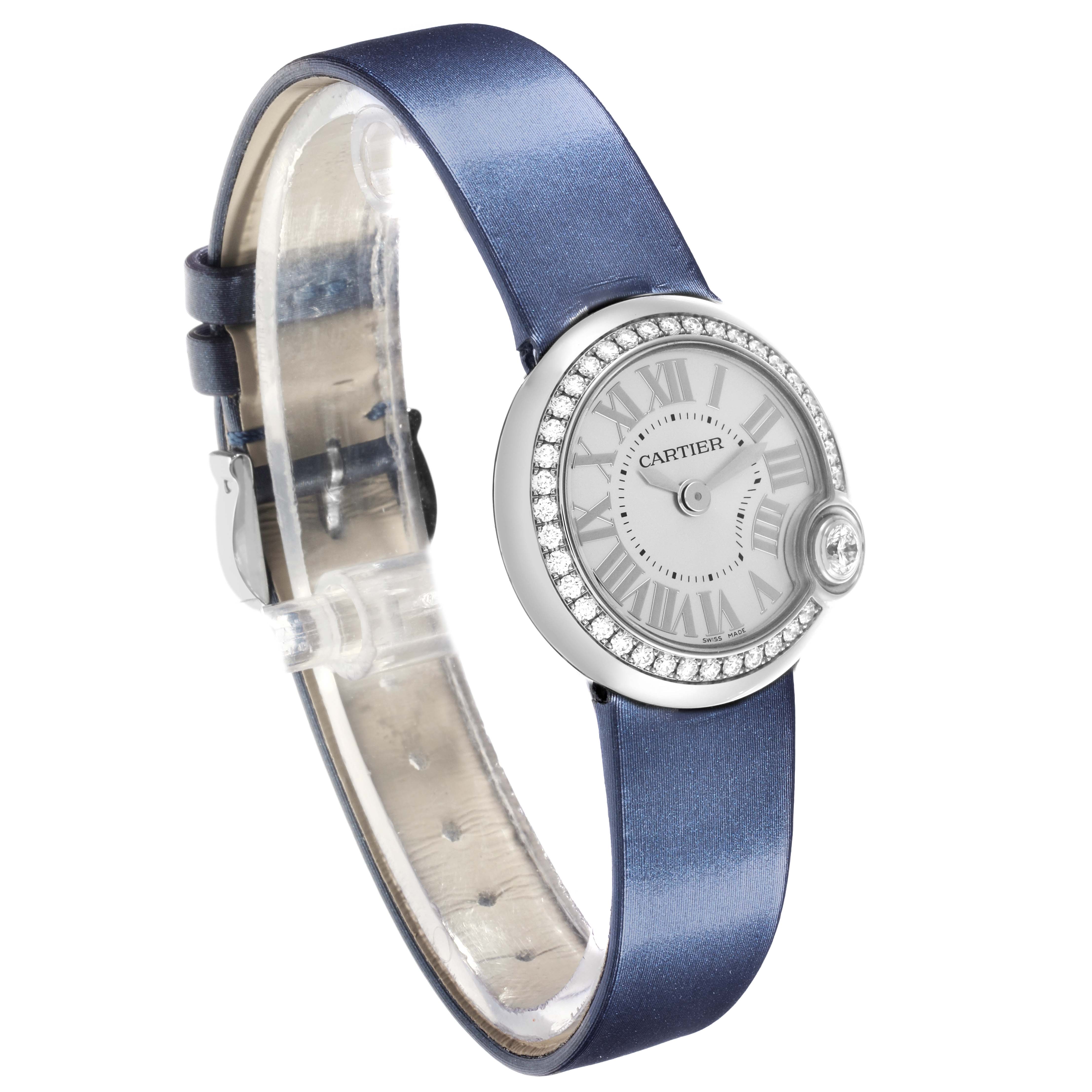 The Cartier Ballon Blanc W4BL0002 Women's Stainless Steel Silver Dial W4BL0002 Women's Stainless Steel Silver Dial watch is shown at a three-quarter angle, highlighting the face, diamond bezel, and blue strap.