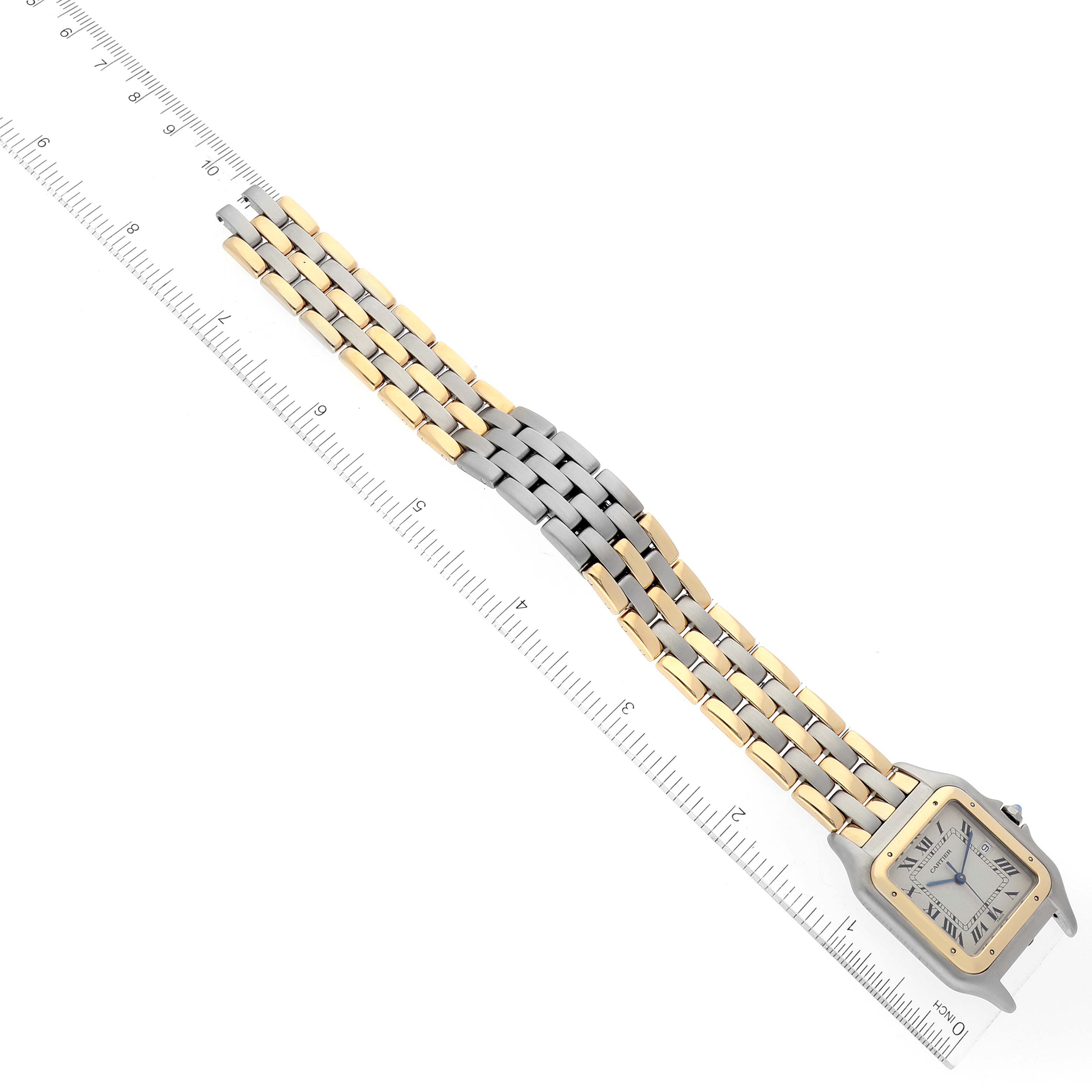 The image shows the full length of the Cartier Panthere 30834 Men's Steel and Gold (two tone) Silver Dial 30834 Men's Steel and Gold (two tone) Silver Dial watch laid flat next to a ruler, highlighting its bracelet and face.
