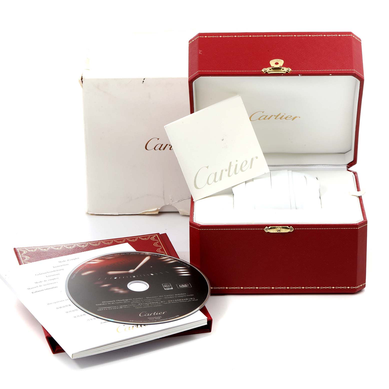 The image shows the packaging and accessories for a Cartier Roadster W62002V3 Men's Stainless Steel Black Dial W62002V3 Men's Stainless Steel Black Dial watch, including a red box, booklet, and CD.