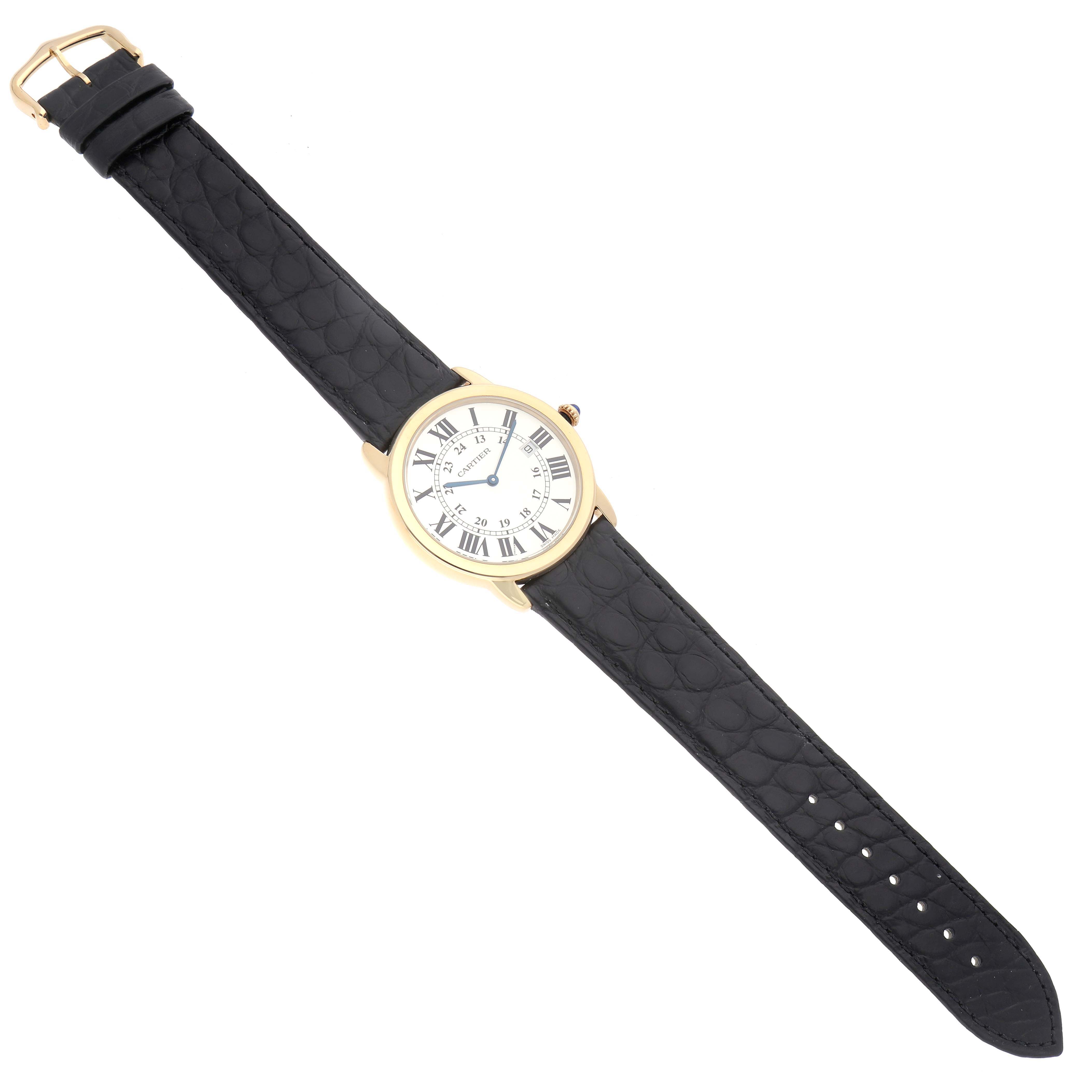 The Cartier Ronde W6700455 Men's Steel and Gold (two tone) Silver Dial W6700455 Men's Steel and Gold (two tone) Silver Dial watch is shown from a top-down angle, featuring a gold case, Roman numeral dial, and a black leather strap.