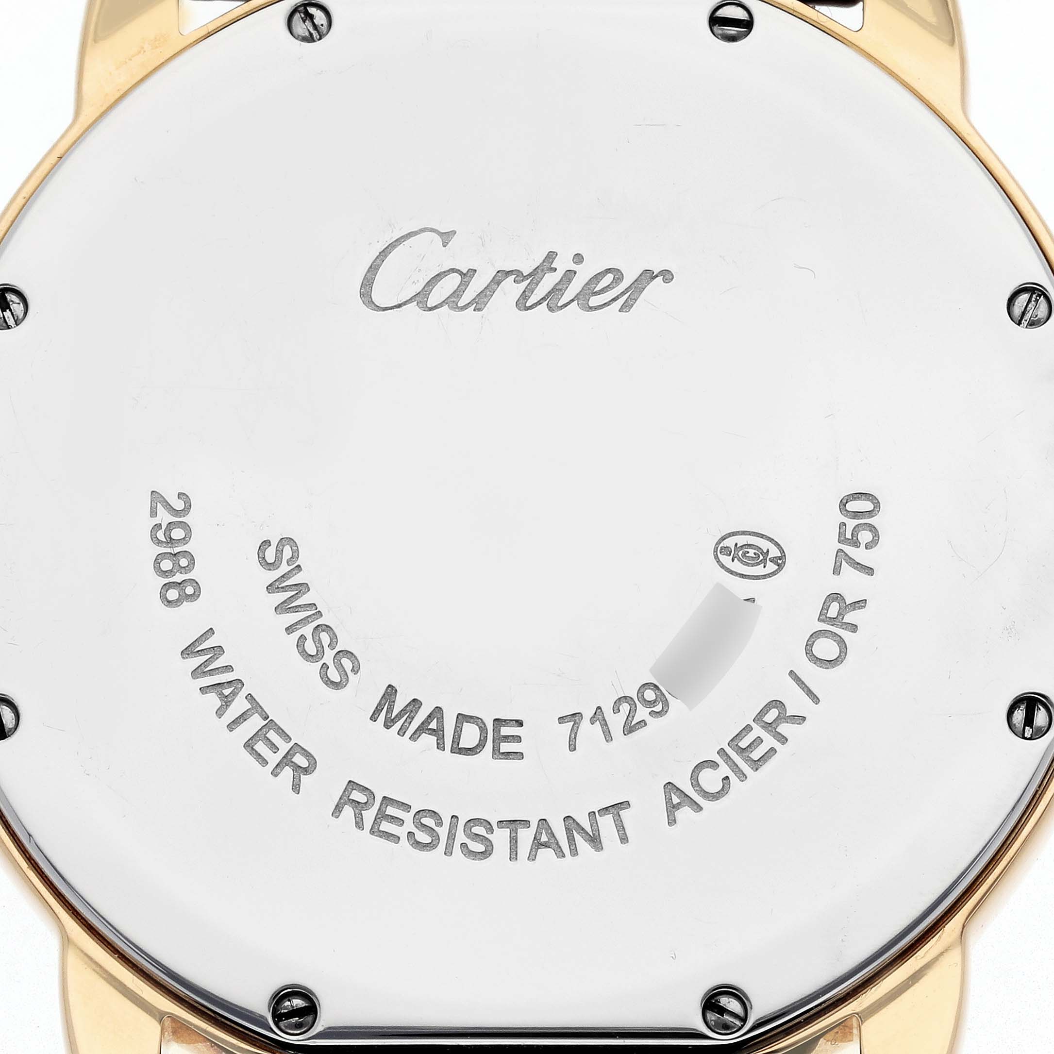 The image shows the back of a Cartier Ronde W6700455 Men's Steel and Gold (two tone) Silver Dial W6700455 Men's Steel and Gold (two tone) Silver Dial watch, focusing on its engraved details and screws.