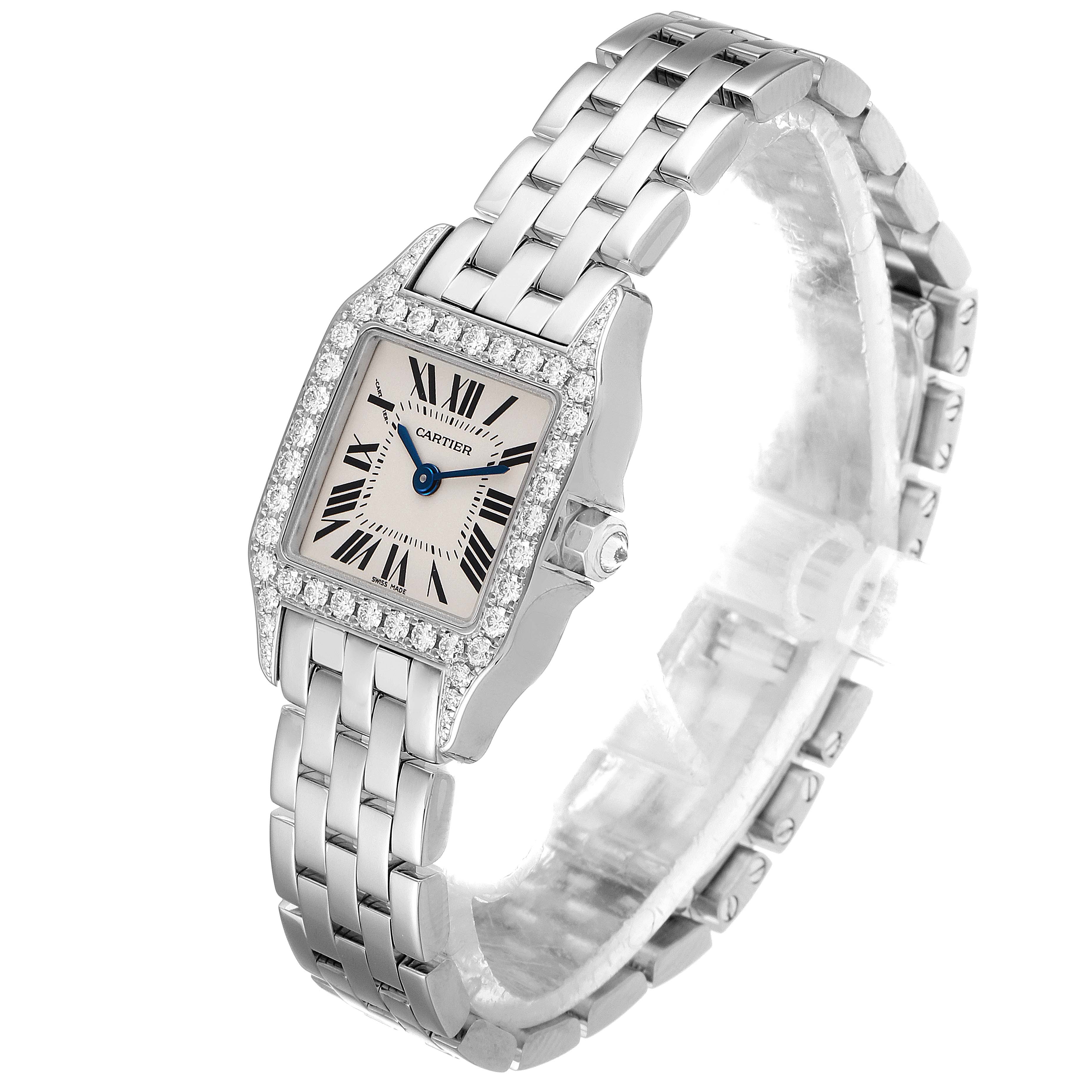 This image shows a Cartier Santos Demoiselle WF9005Y8 Women's White Gold Silver Dial WF9005Y8 Women's White Gold Silver Dial watch from a front angle, displaying its rectangular face, Roman numerals, and metal bracelet.