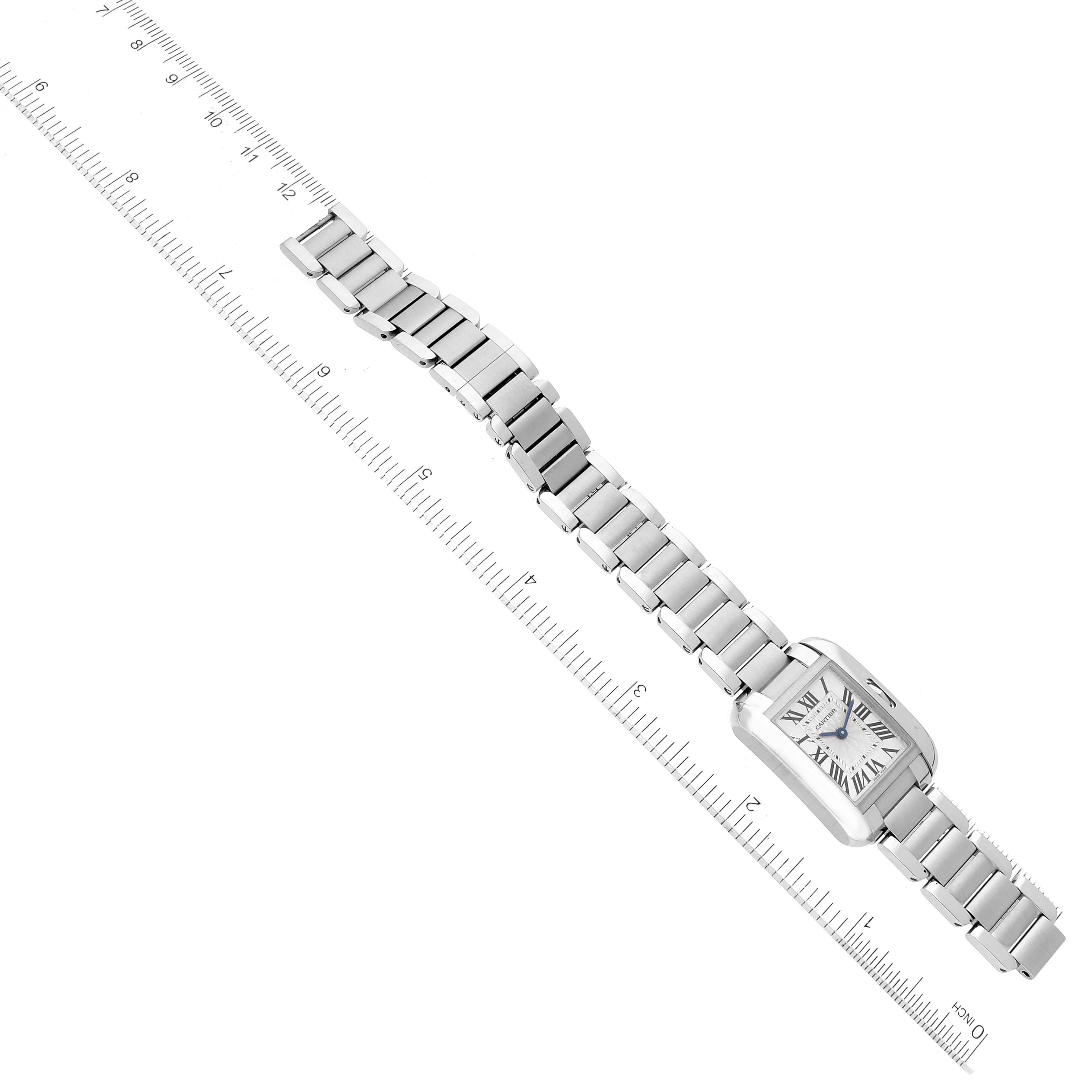 The image shows the Cartier Tank Anglaise W5310022 Women's Stainless Steel Silver Dial W5310022 Women's Stainless Steel Silver Dial watch laying flat with the face and metal strap fully visible, next to a ruler for scale.