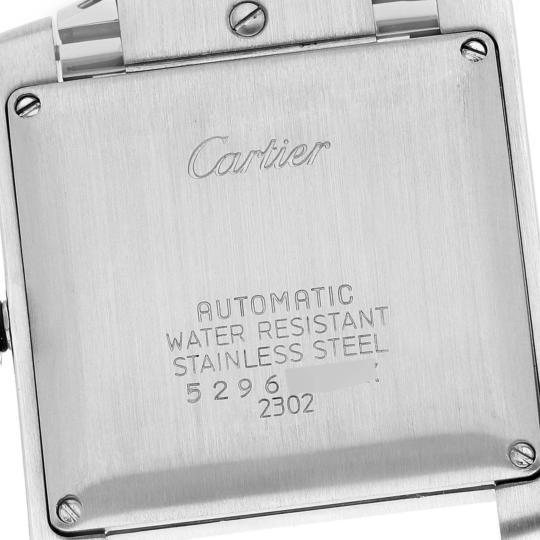 The image shows the back case of a Cartier Tank Française watch, highlighting its engravings and stainless steel material.