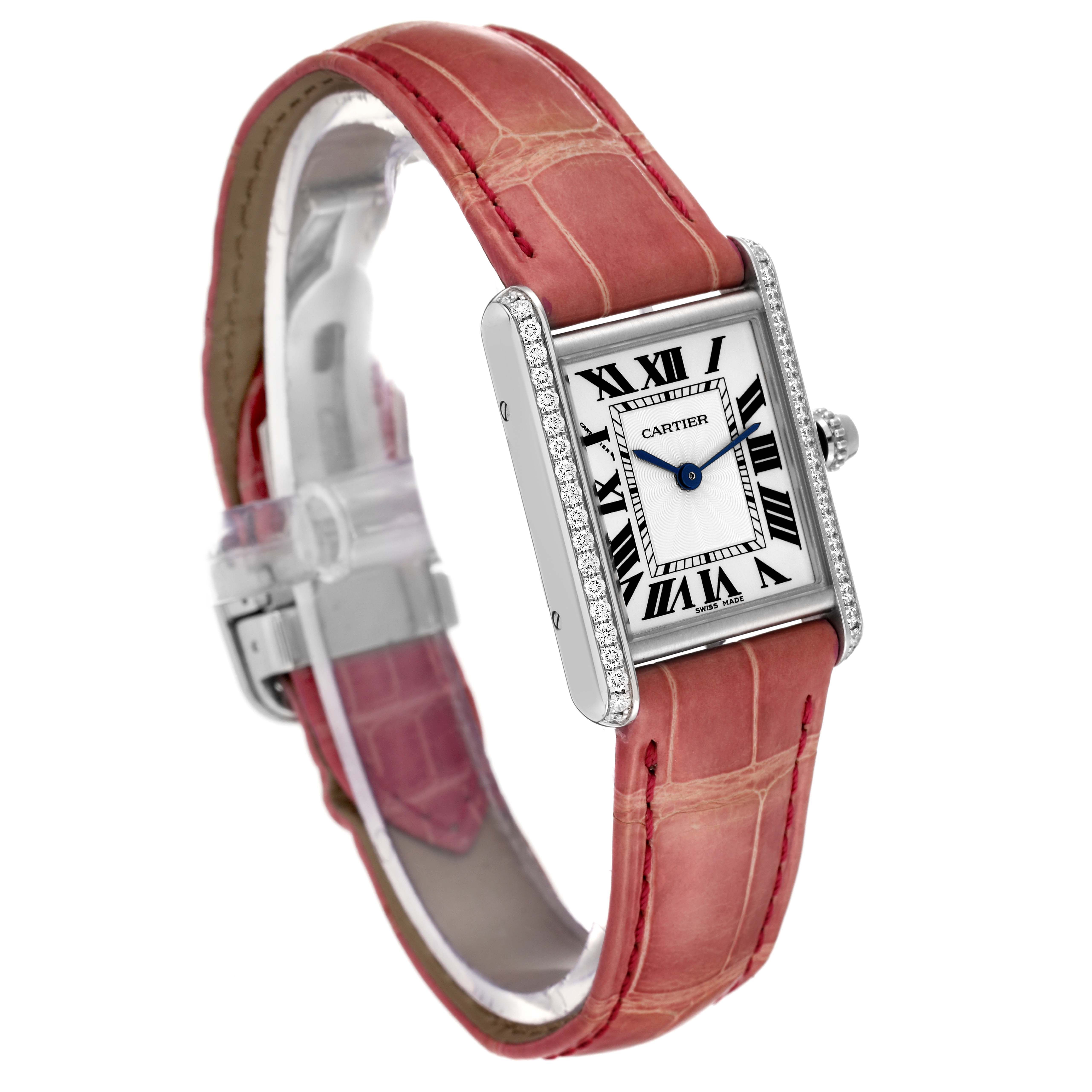 The Cartier Tank Louis WJTA0011 Women's White Gold Silver Dial WJTA0011 Women's White Gold Silver Dial watch is shown at an angle displaying the face, diamond-set bezel, crown, and pink leather strap.