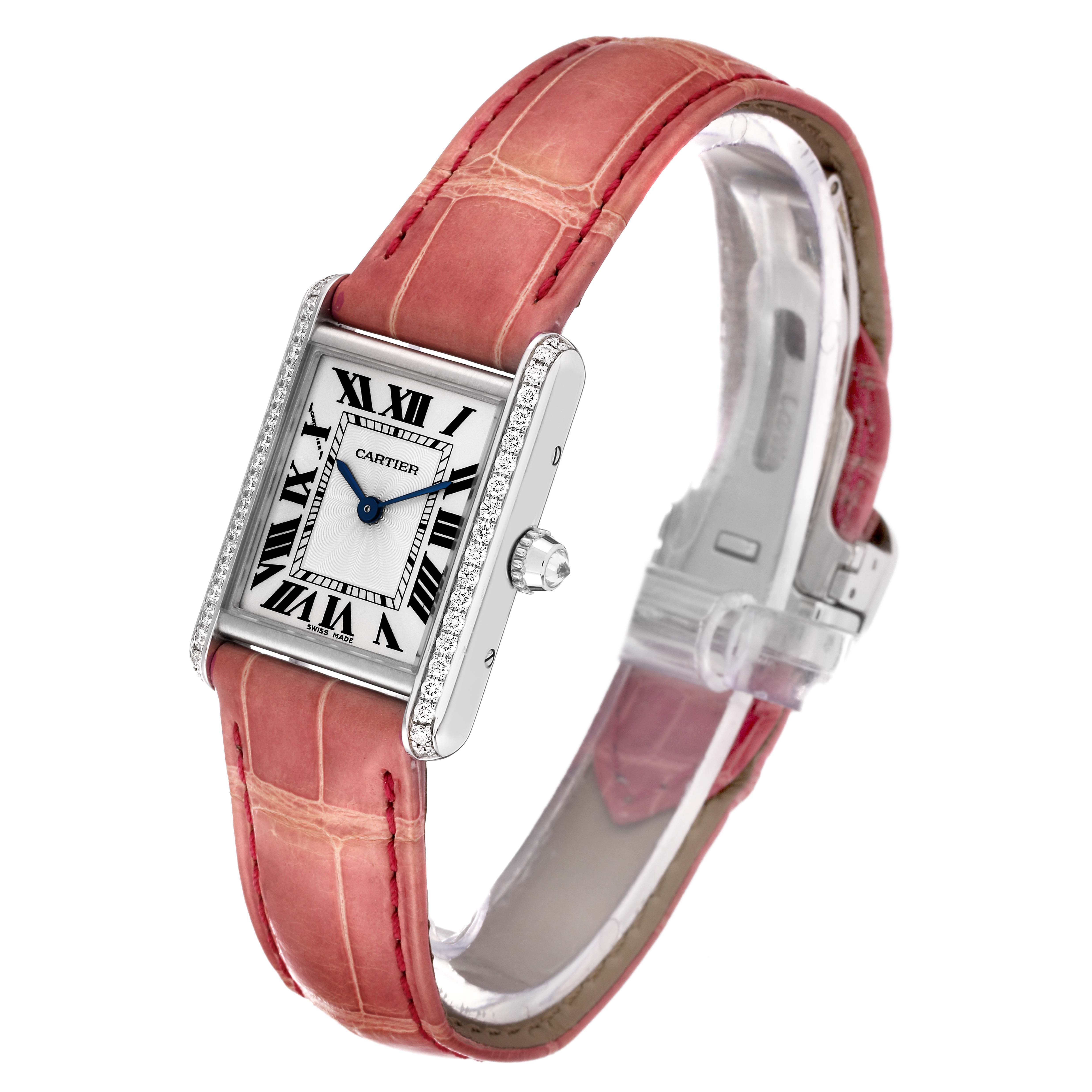 The image shows a Cartier Tank Louis WJTA0011 Women's White Gold Silver Dial WJTA0011 Women's White Gold Silver Dial watch at a three-quarter angle featuring a pink strap and diamond-encrusted case.