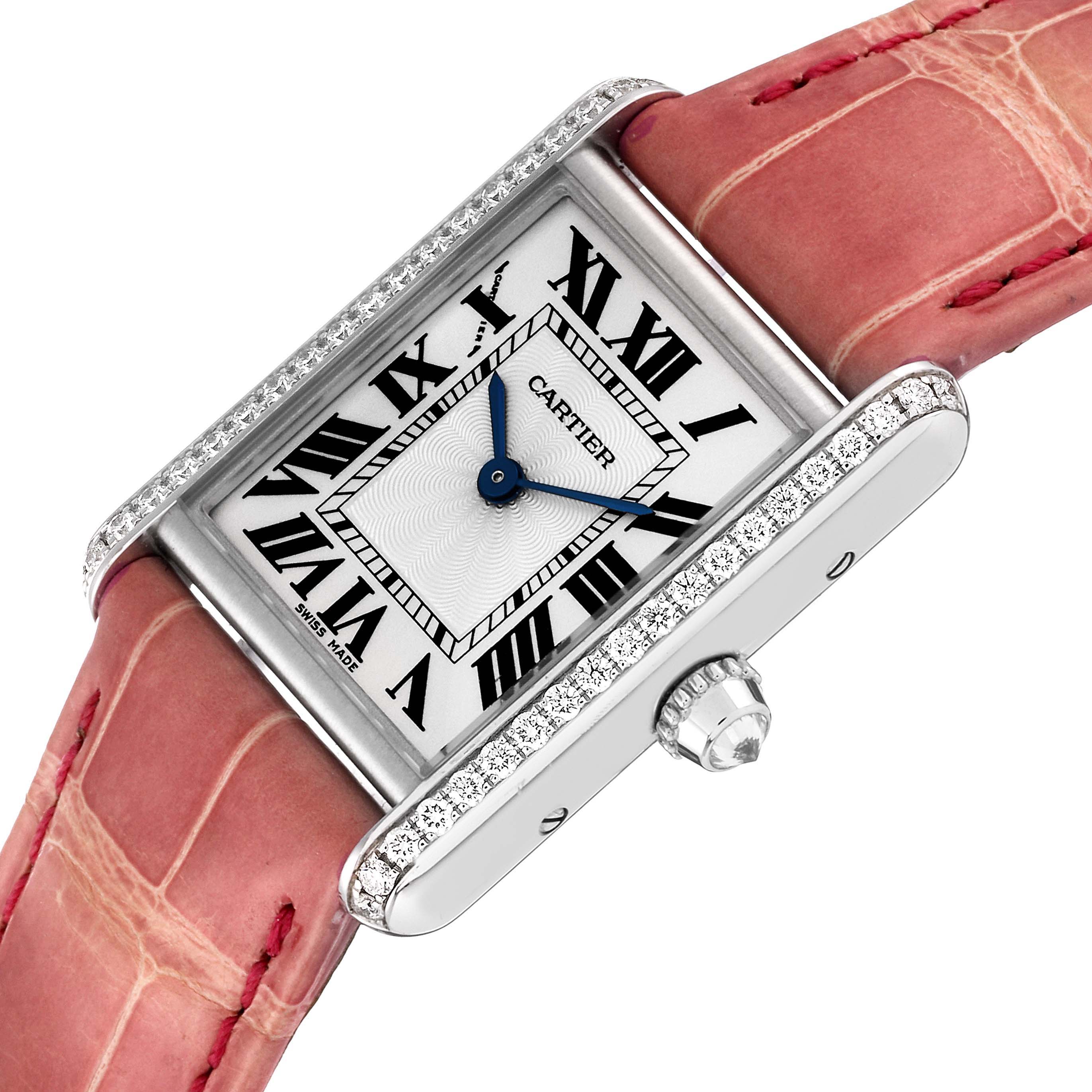 The Cartier Tank Louis WJTA0011 Women's White Gold Silver Dial WJTA0011 Women's White Gold Silver Dial watch is shown at a diagonal angle, highlighting the face, crown, and a portion of the pink strap.