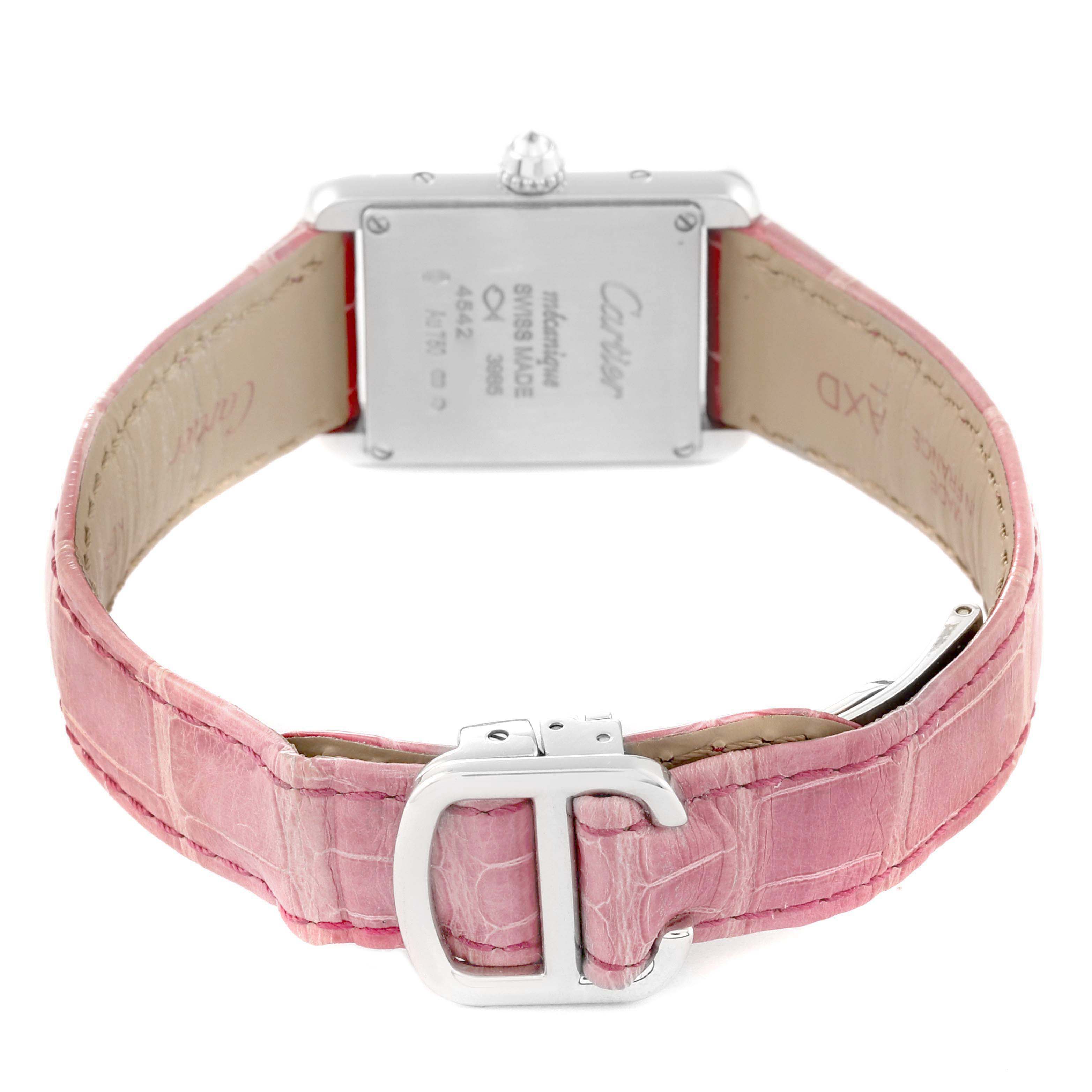 The Cartier Tank Louis WJTA0011 Women's White Gold Silver Dial watch is shown from the back, highlighting the case back and pink leather strap with a buckle.