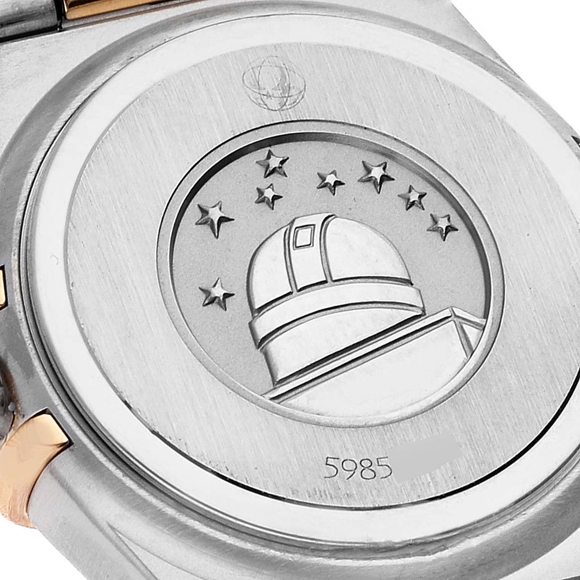 This image shows the case back of the Omega 1360.79.00 Women's Steel and Gold (two tone) Mother of Pearl Dial 1360.79.00 Women's Steel and Gold (two tone) Mother of Pearl Dial Constellation Iris Steel Rose Gold MOP Diamond Ladies Watch 1360.79.00, featuring an embossed observatory.