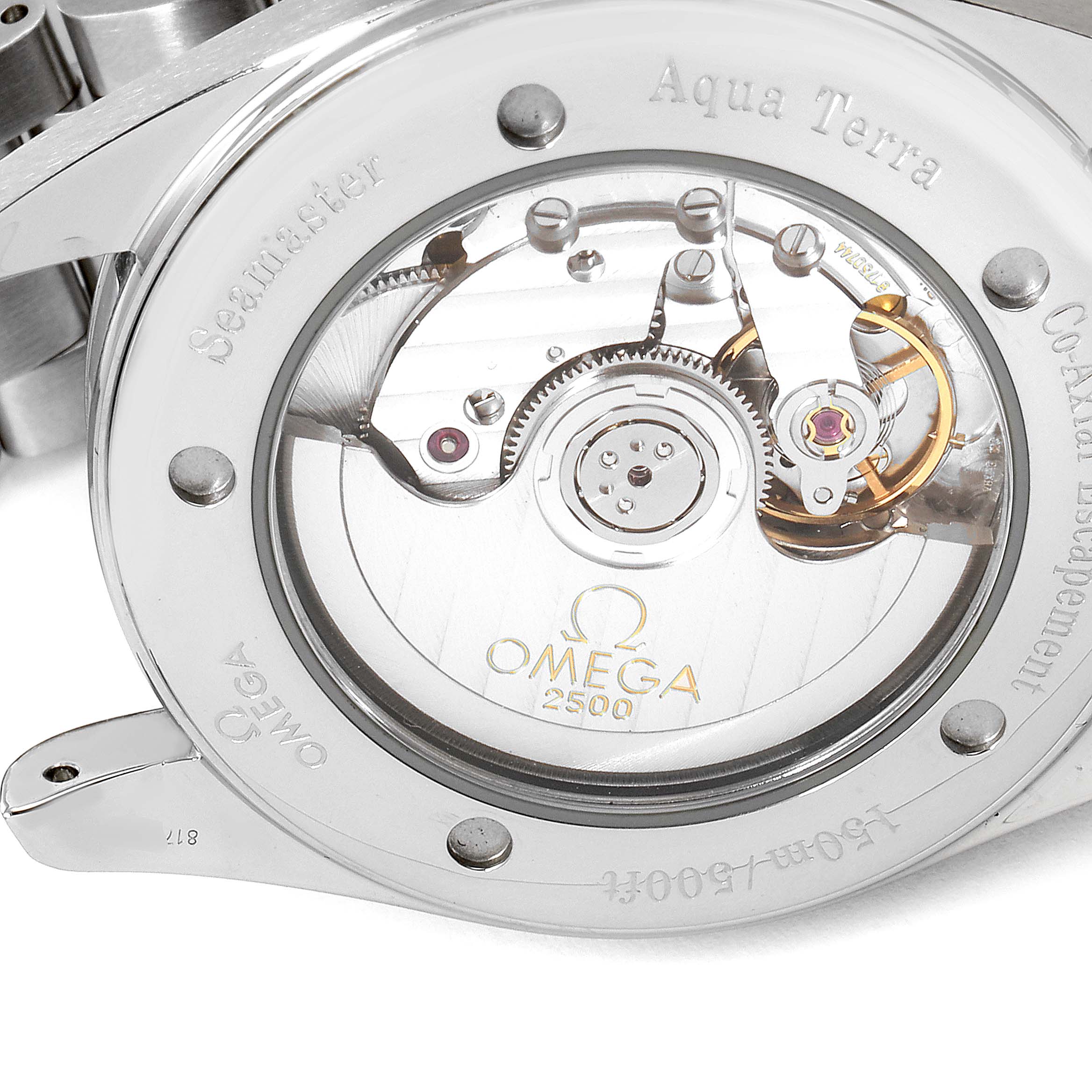 This image shows the back case of the Omega Aqua Terra 2503.50.00 Men
s Stainless Steel Black Dial 2503.50.00 Men
s Stainless Steel Black Dial watch, highlighting its inner mechanical movement and Co-Axial escapement.