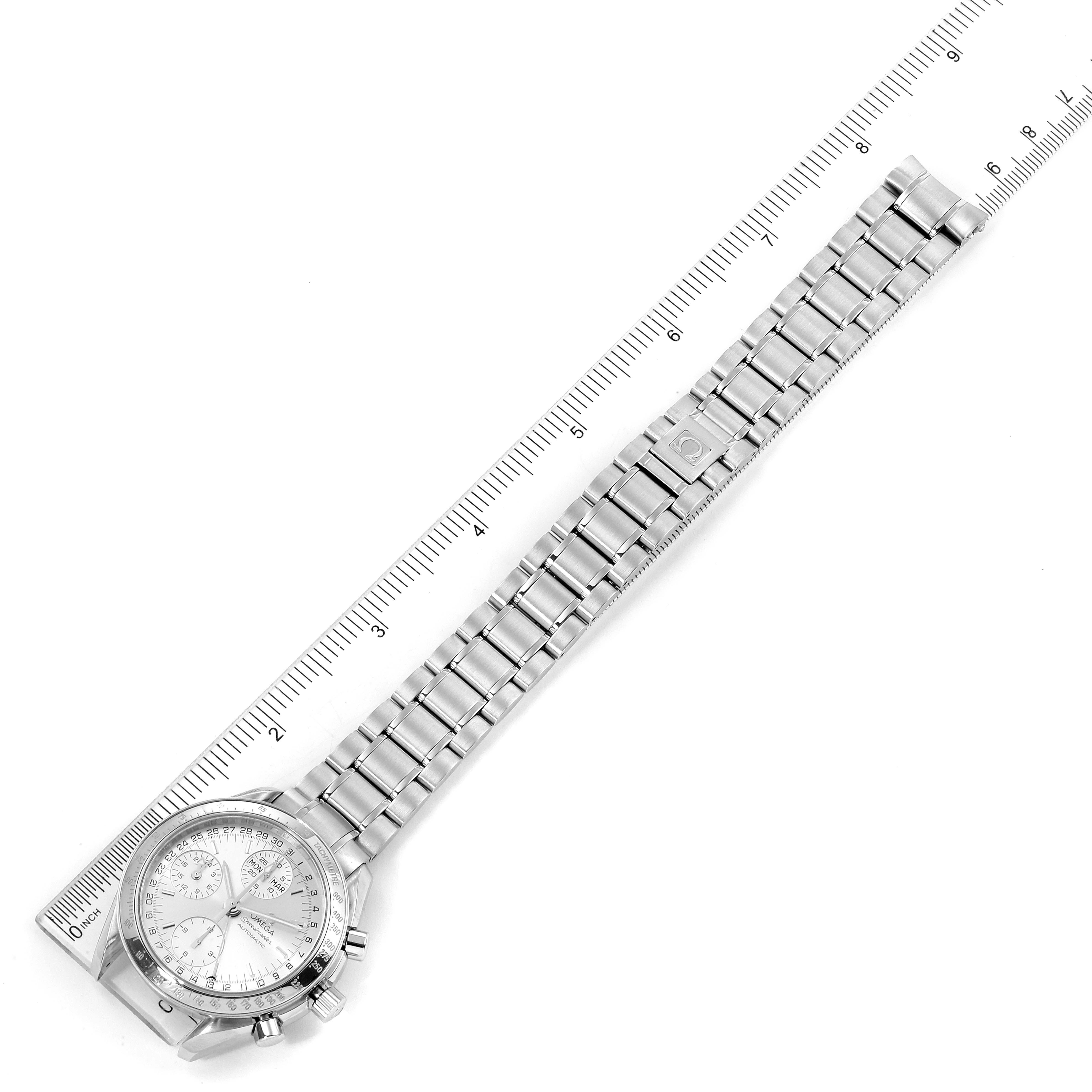 This image shows an Omega Speedmaster 3523.30.00 Men's Stainless Steel Silver Dial 3523.30.00 Men's Stainless Steel Silver Dial watch laid flat alongside a ruler, displaying the face and metal bracelet.