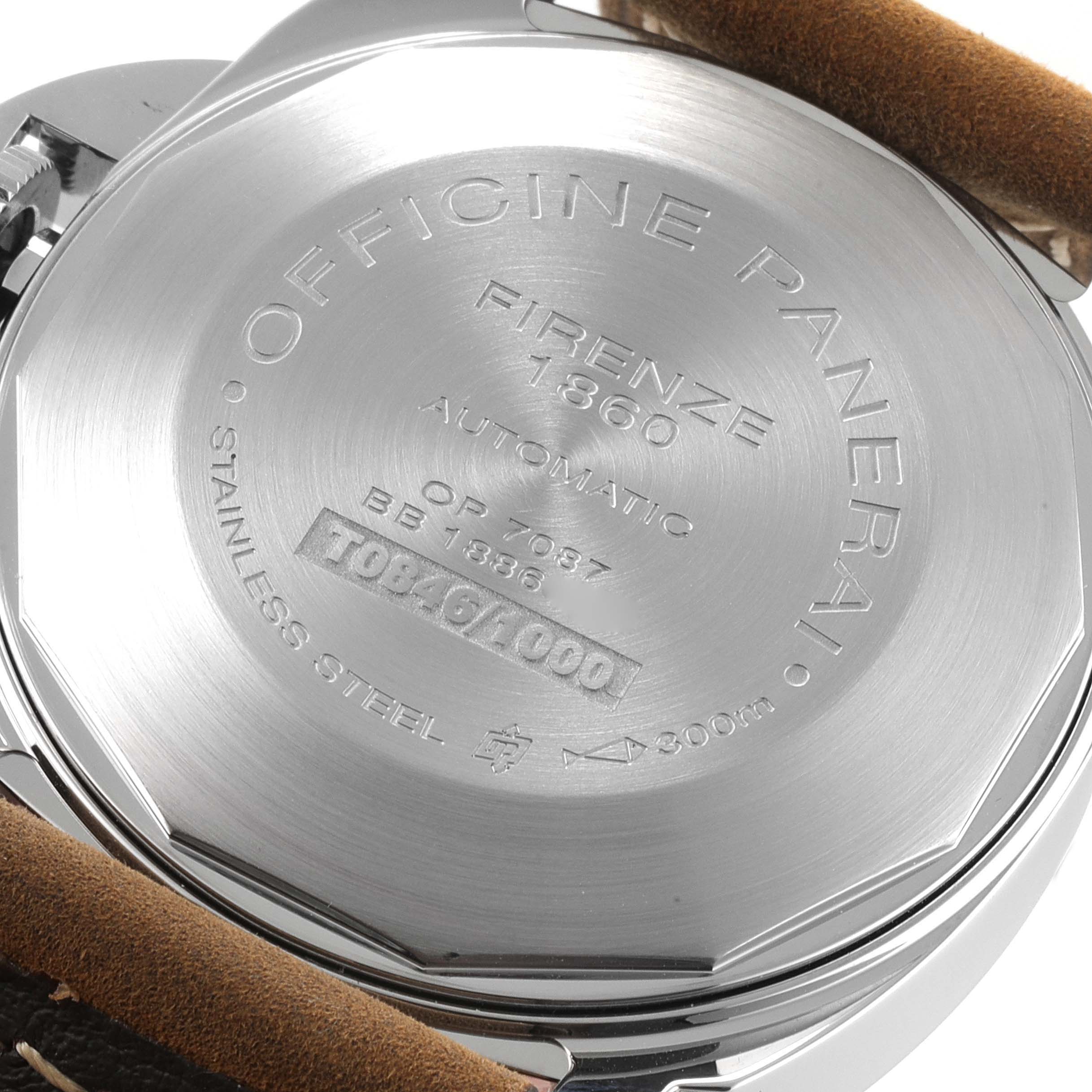 The image shows the back case of a Panerai Luminor PAM01048 Men
s Stainless Steel Black Dial PAM01048 Men
s Stainless Steel Black Dial watch, displaying engravings and part of the leather strap.