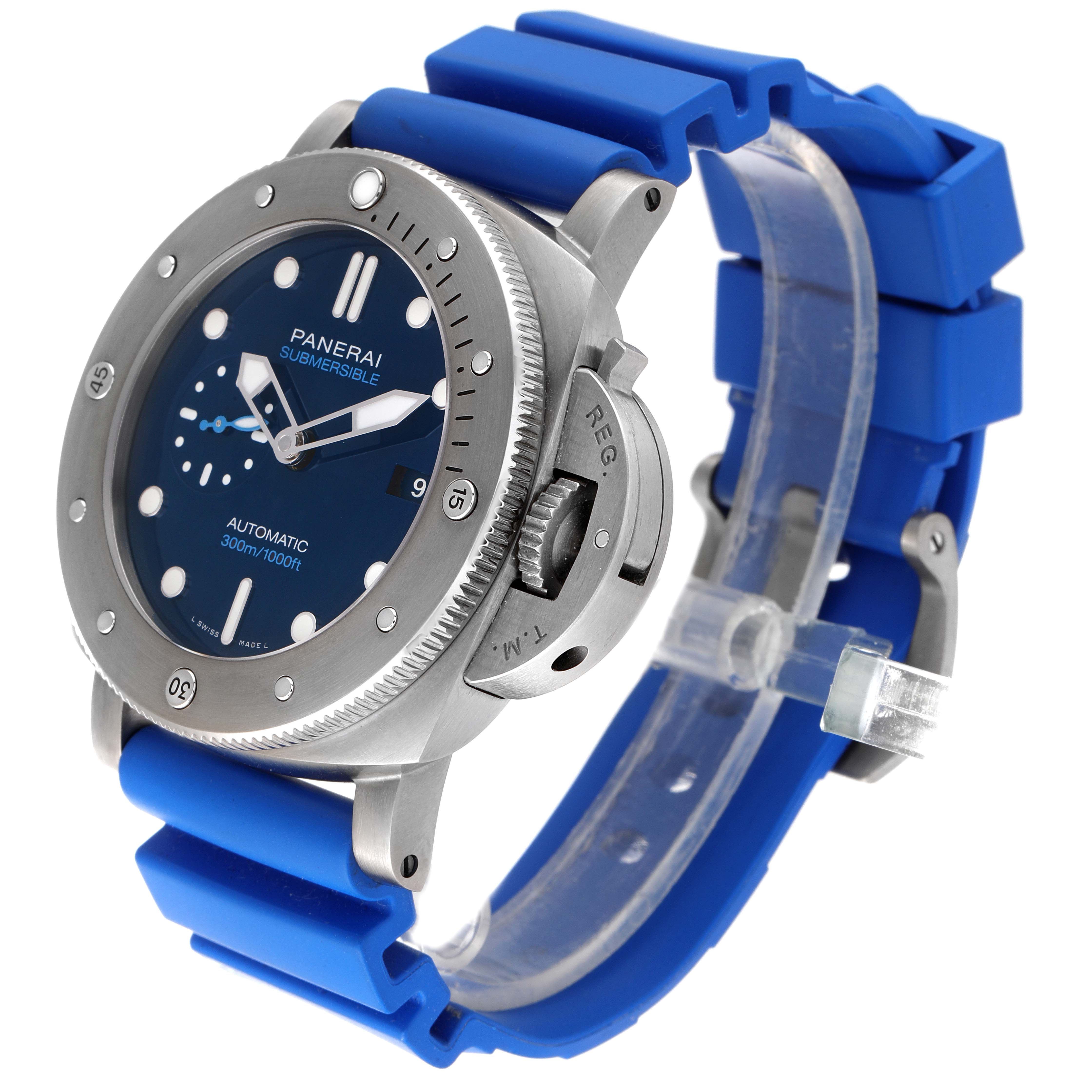 The Panerai Submersible PAM00692 Men's Titanium Blue Dial PAM00692 Men's Titanium Blue Dial watch is shown at a front-side angle with the face, bezel, crown guard, and blue strap visible.