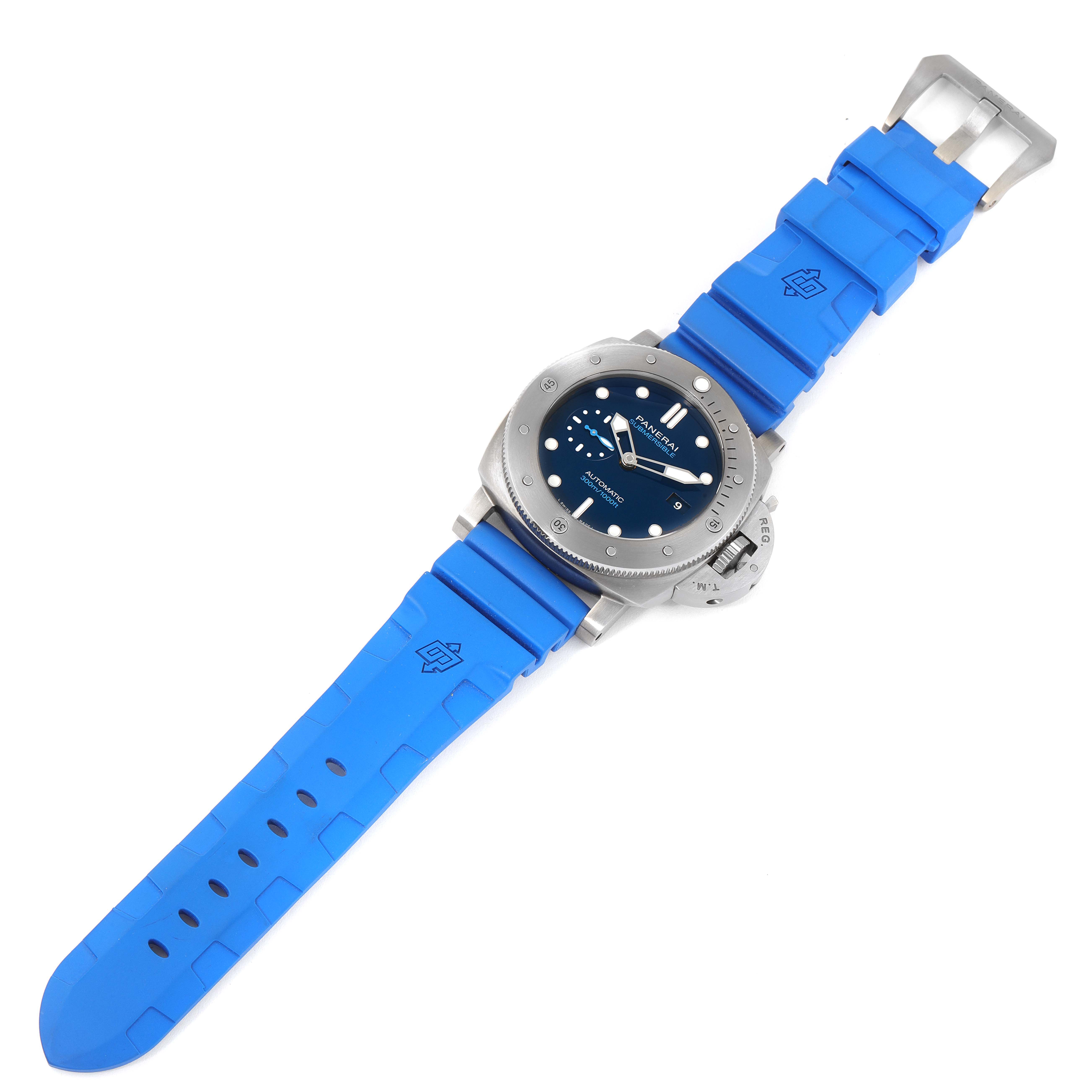 This image shows a top-down view of a Panerai Submersible PAM00692 Men's Titanium Blue Dial PAM00692 Men's Titanium Blue Dial watch with a blue rubber strap.