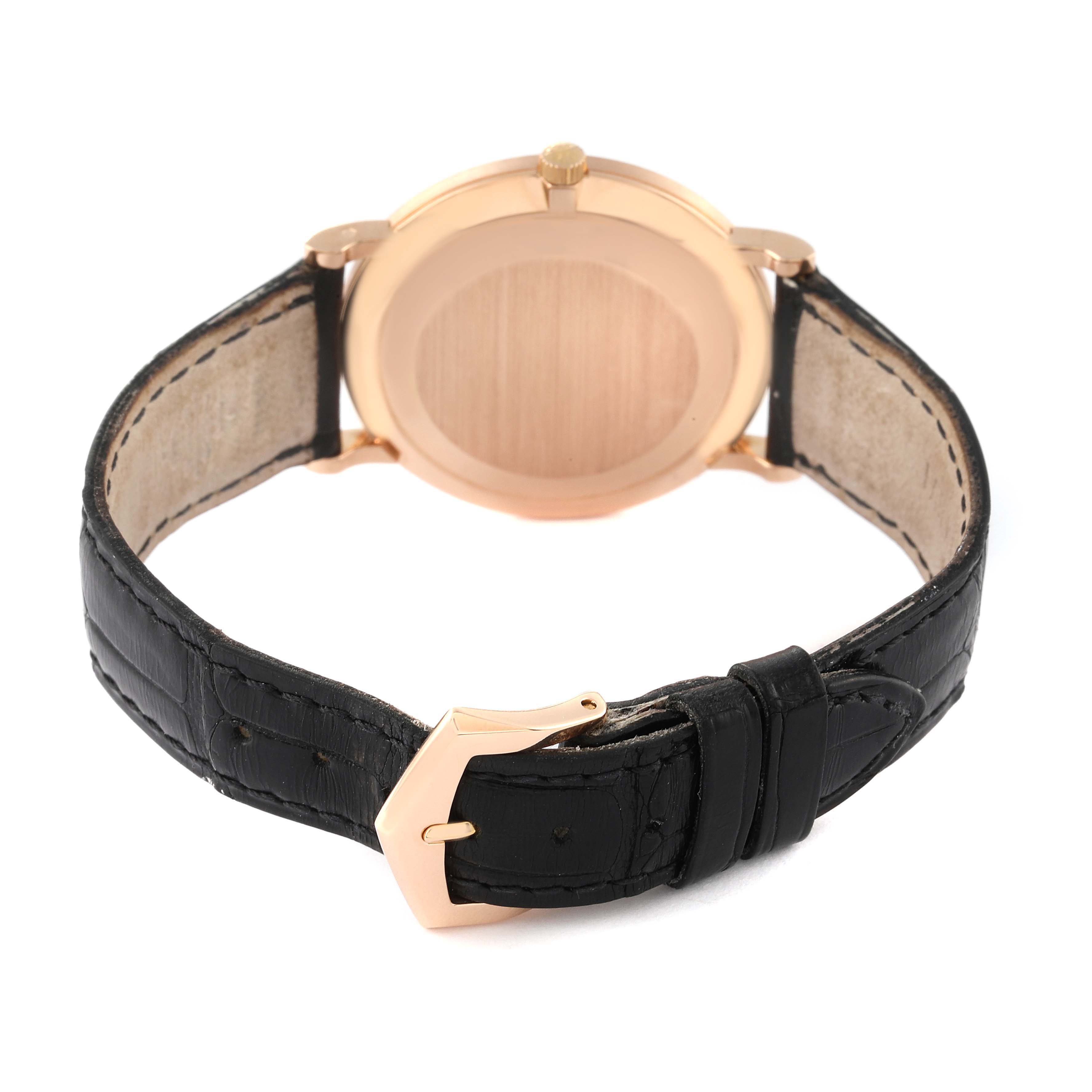 The image shows the back of the Patek Philippe Calatrava 3919R Men's Rose Gold White Dial 3919R Men's Rose Gold White Dial watch, including the case and black leather strap with a buckle.