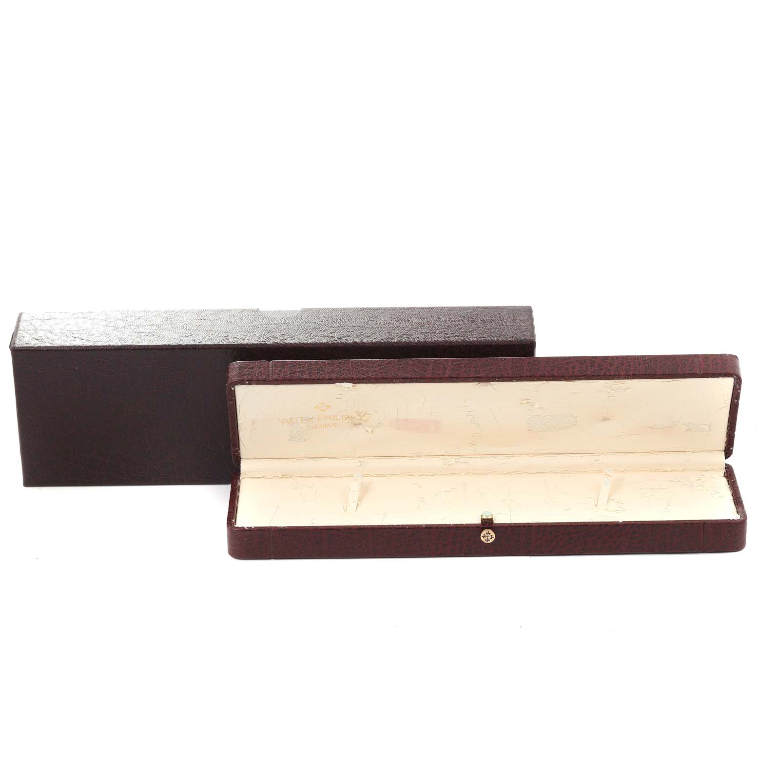 This image shows an open brown box for a Patek Philippe Calatrava 5196G Men's White Gold Silver Dial 5196G Men's White Gold Silver Dial watch, displaying its interior and exterior.