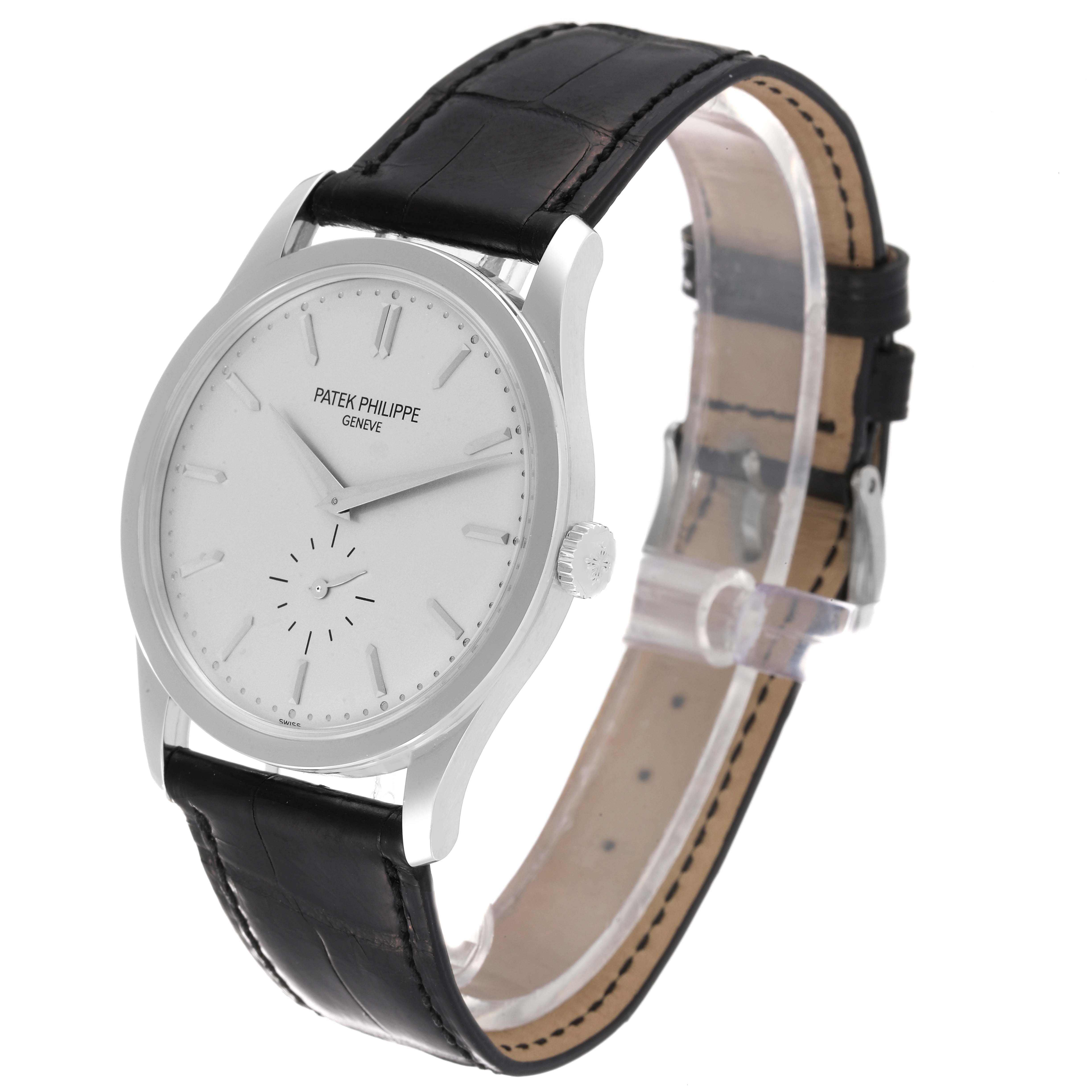 The image shows a Patek Philippe Calatrava 5196G Men's White Gold Silver Dial 5196G Men's White Gold Silver Dial watch from a three-quarter angle, highlighting its face, crown, and leather strap.