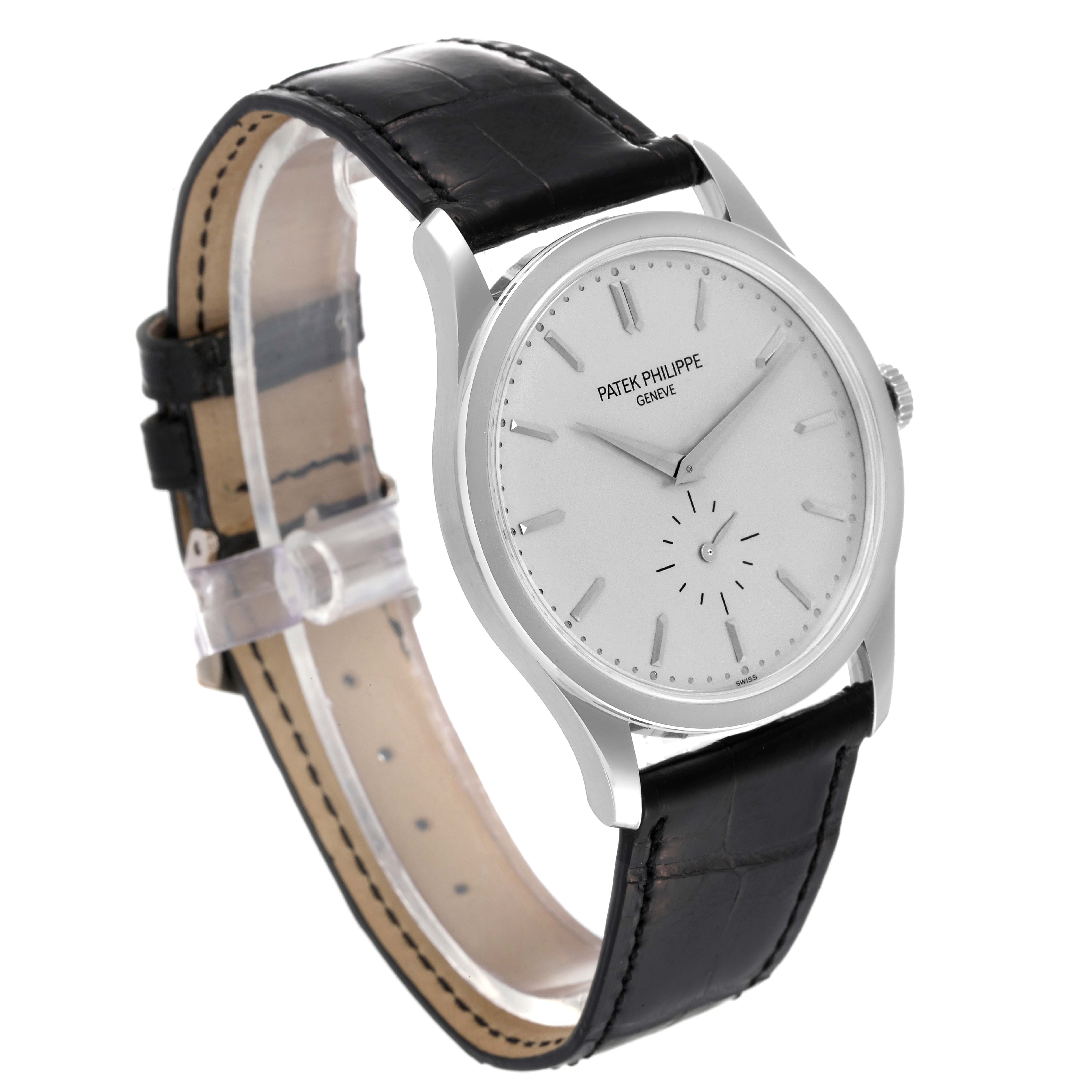The image shows a Patek Philippe Calatrava 5196G Men's White Gold Silver Dial 5196G Men's White Gold Silver Dial watch at a three-quarter angle, highlighting the face, bezel, and strap.