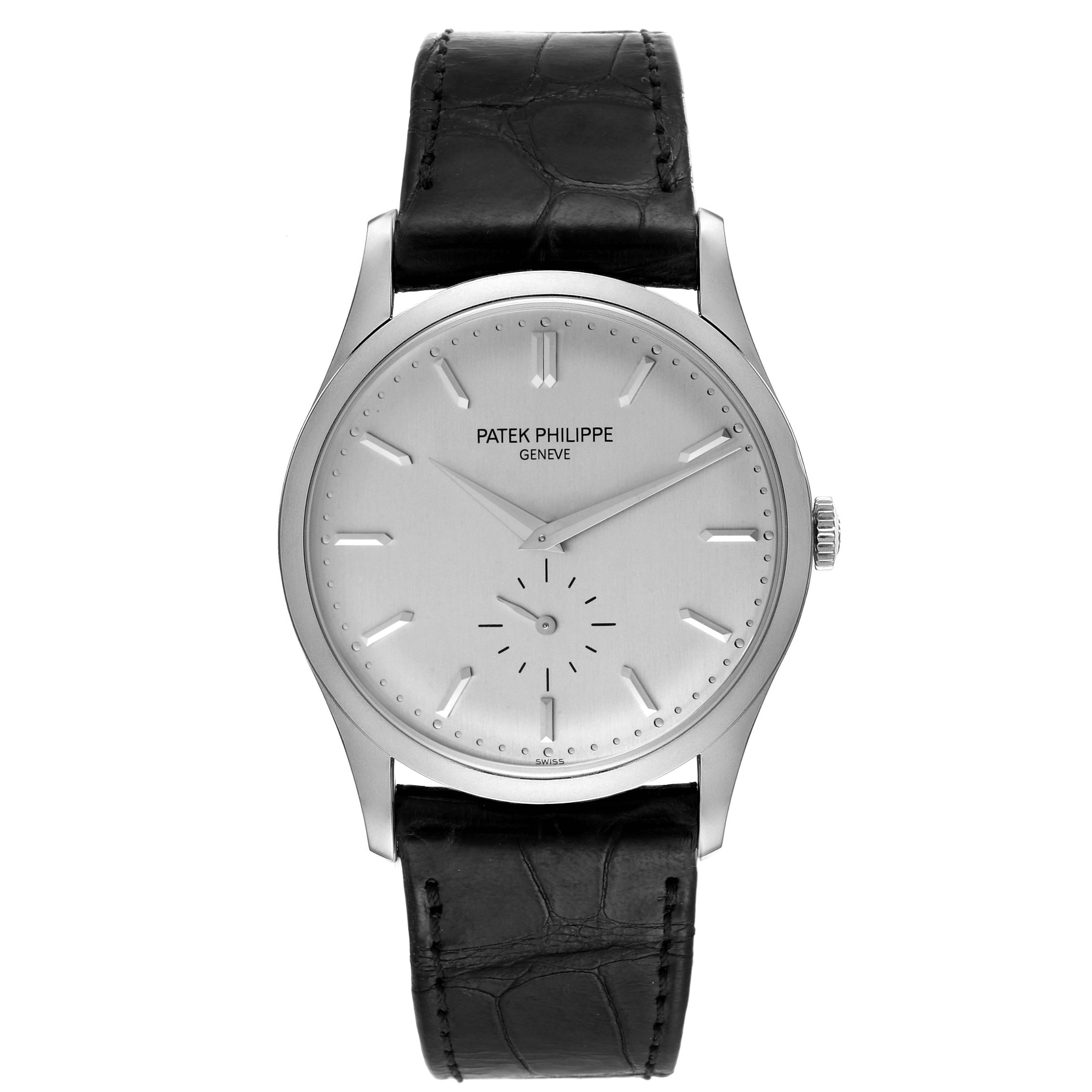 The image shows a front view of a Patek Philippe Calatrava 5196G Men
s White Gold Silver Dial 5196G Men
s White Gold Silver Dial watch with a silver dial and black leather strap.