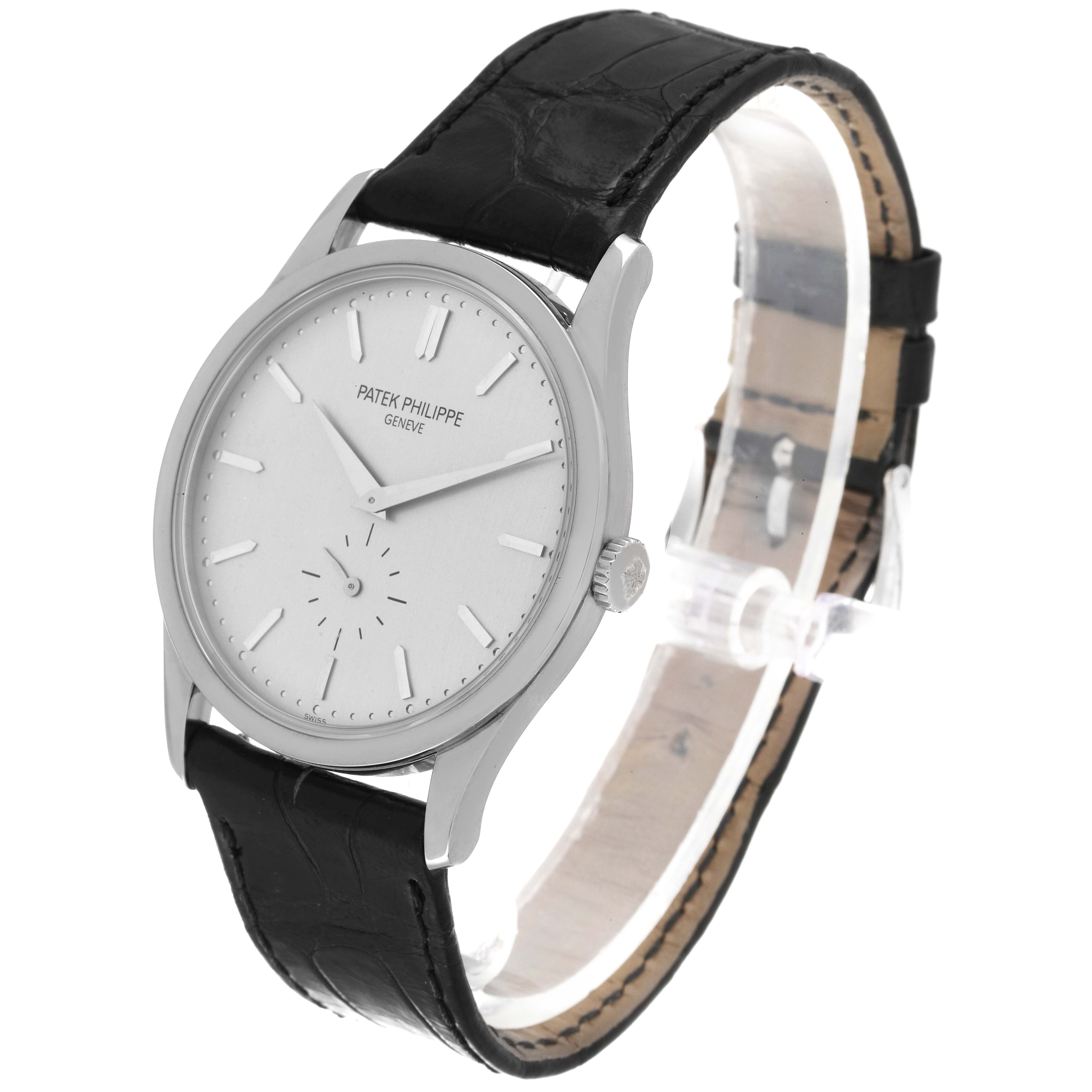 The image shows a Patek Philippe Calatrava 5196G Men
s White Gold Silver Dial 5196G Men
s White Gold Silver Dial watch at a slight angle, highlighting the face, crown, and leather strap.