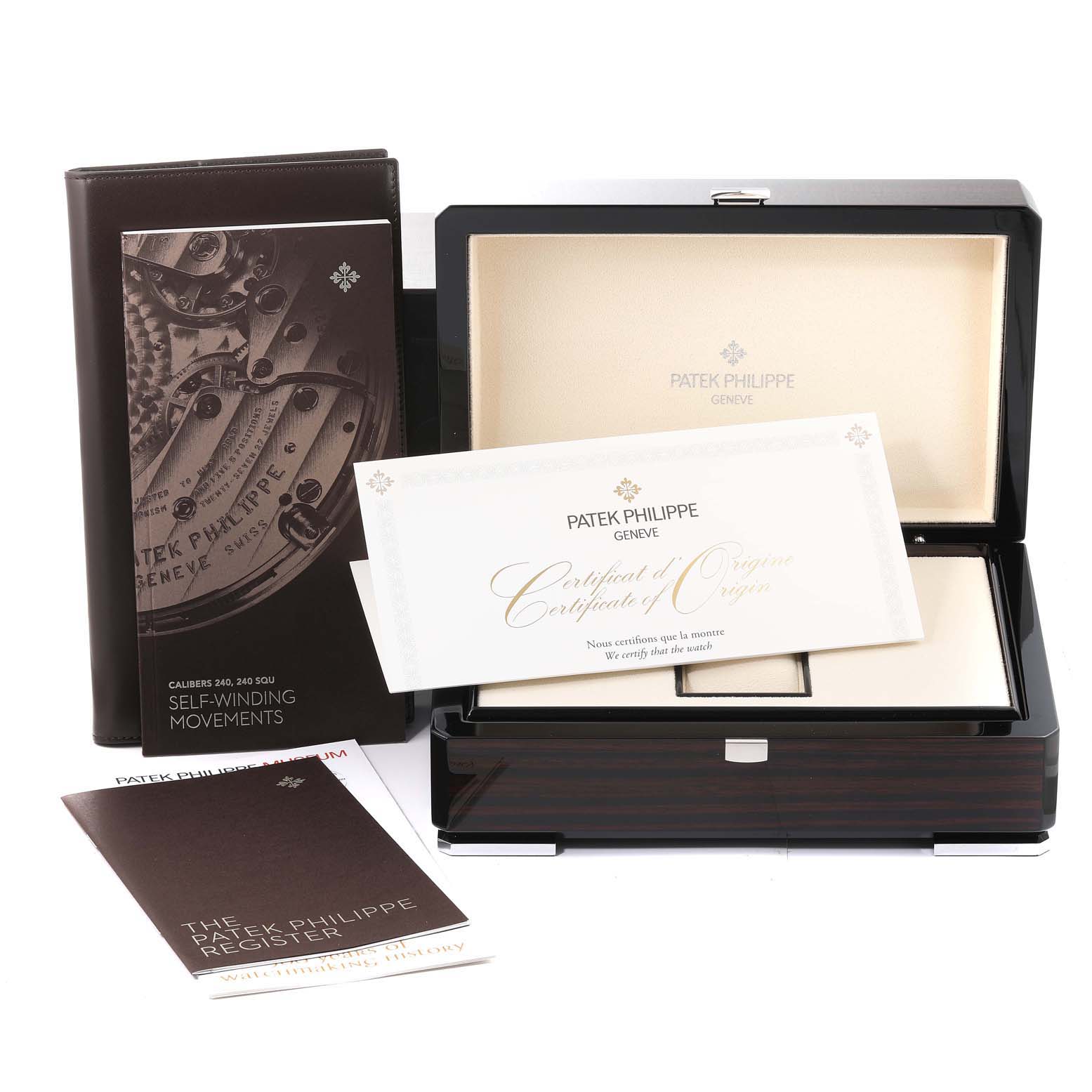 The image shows packaging, documents, and a certificate for a Golden Ellipse model by Patek Philippe.