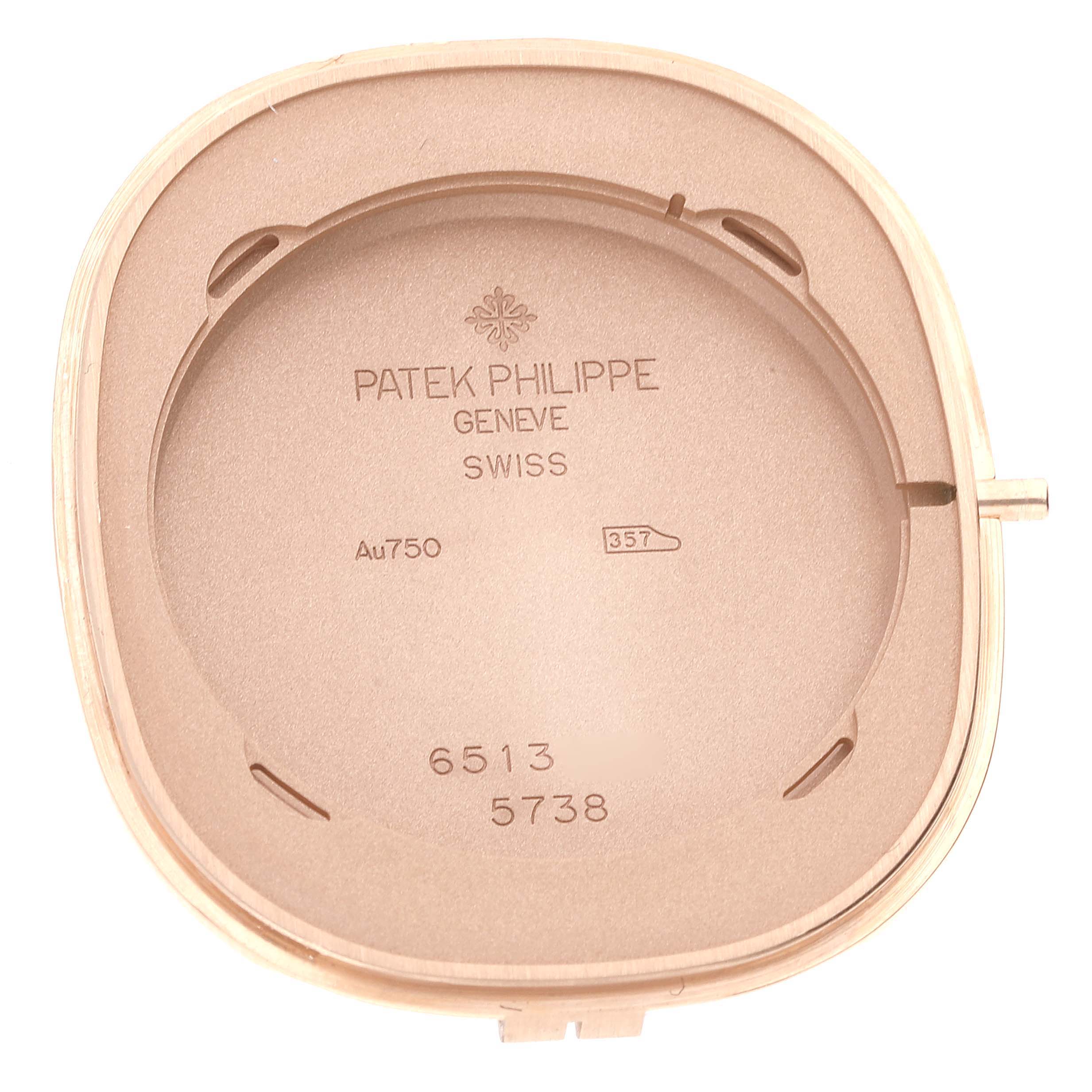 The image shows the inside back case of the Patek Philippe Golden Ellipse 5738 Men's Rose Gold Black Dial 5738 Men's Rose Gold Black Dial watch, displaying engravings and hallmarks.