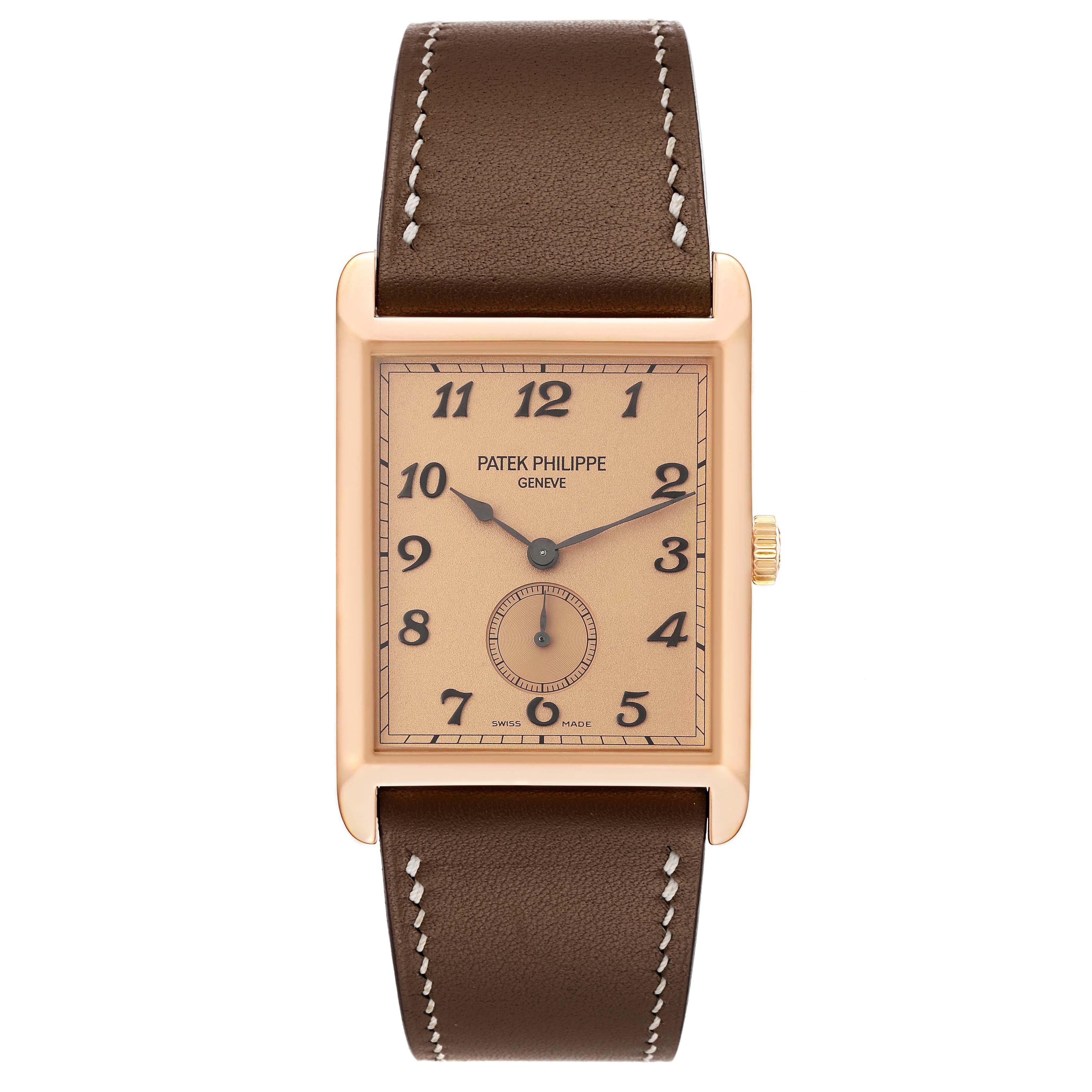 The Patek Philippe Gondolo 5109R Men's Rose Gold Pink Dial 5109R Men's Rose Gold Pink Dial watch is shown from a front angle, highlighting its rectangular face and brown leather strap.