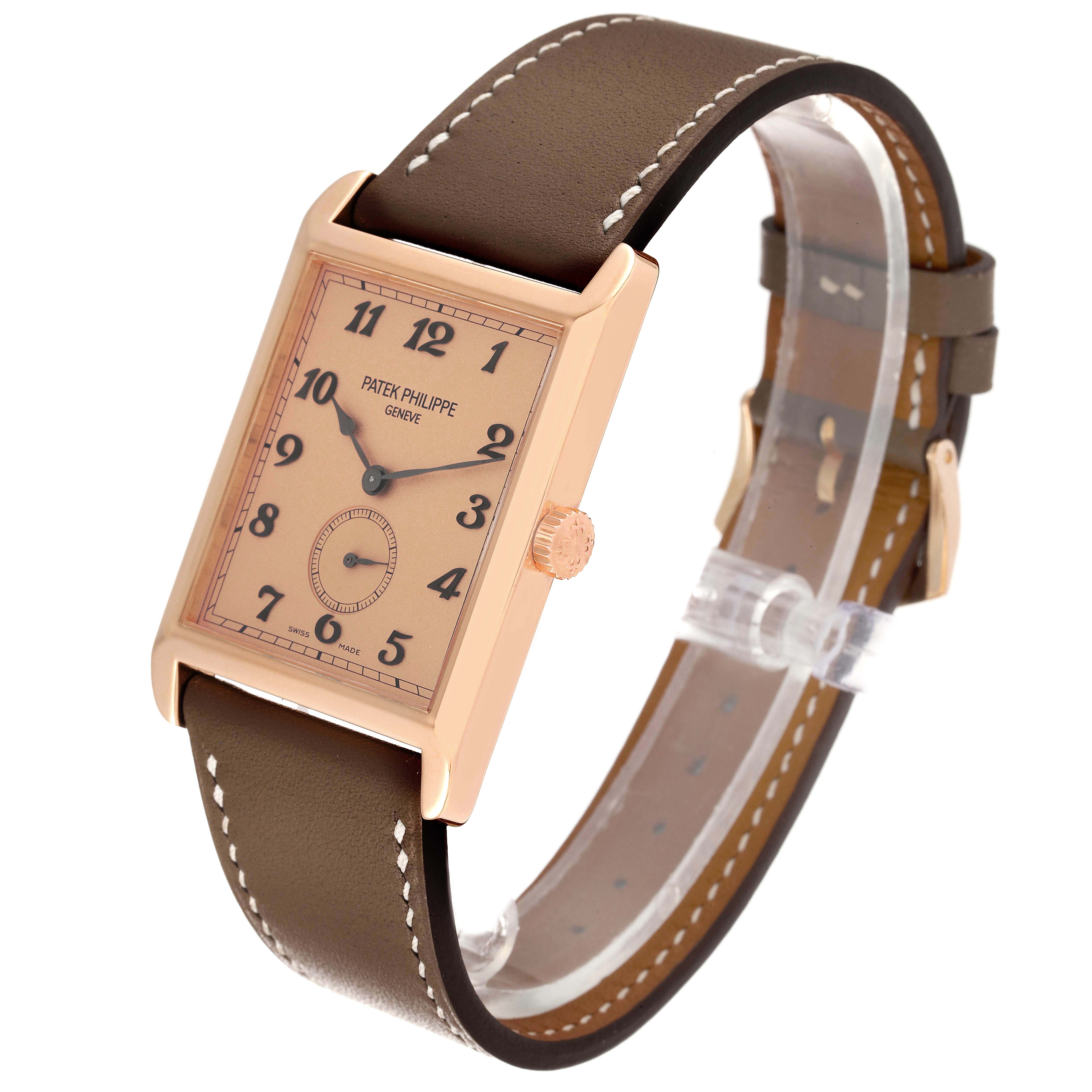 The Patek Philippe Gondolo 5109R Men's Rose Gold Pink Dial 5109R Men's Rose Gold Pink Dial watch is shown at an angled view, highlighting its rectangular face, crown, and brown leather strap.