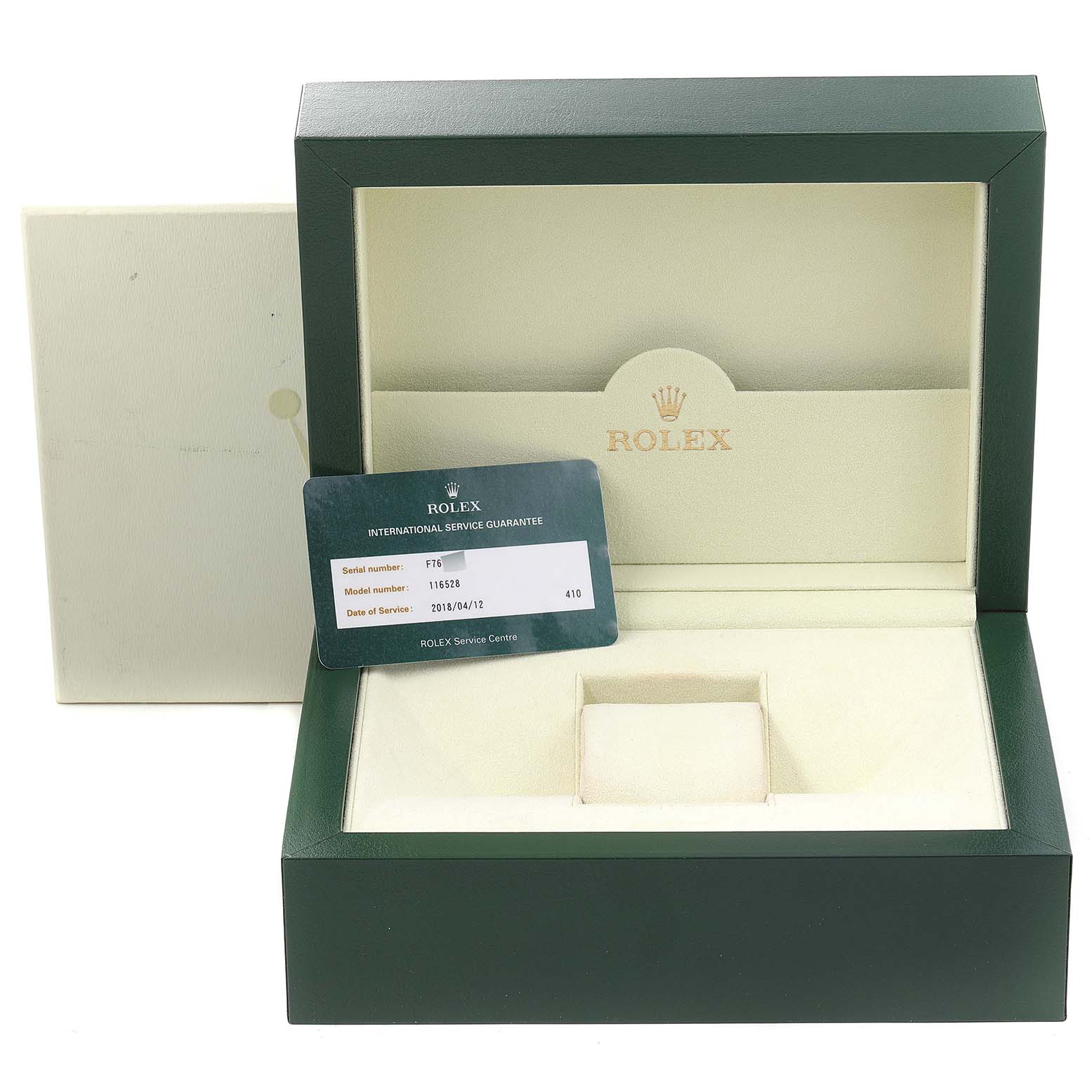 This image shows an open Rolex watch box for the Daytona model, along with an international service guarantee card.